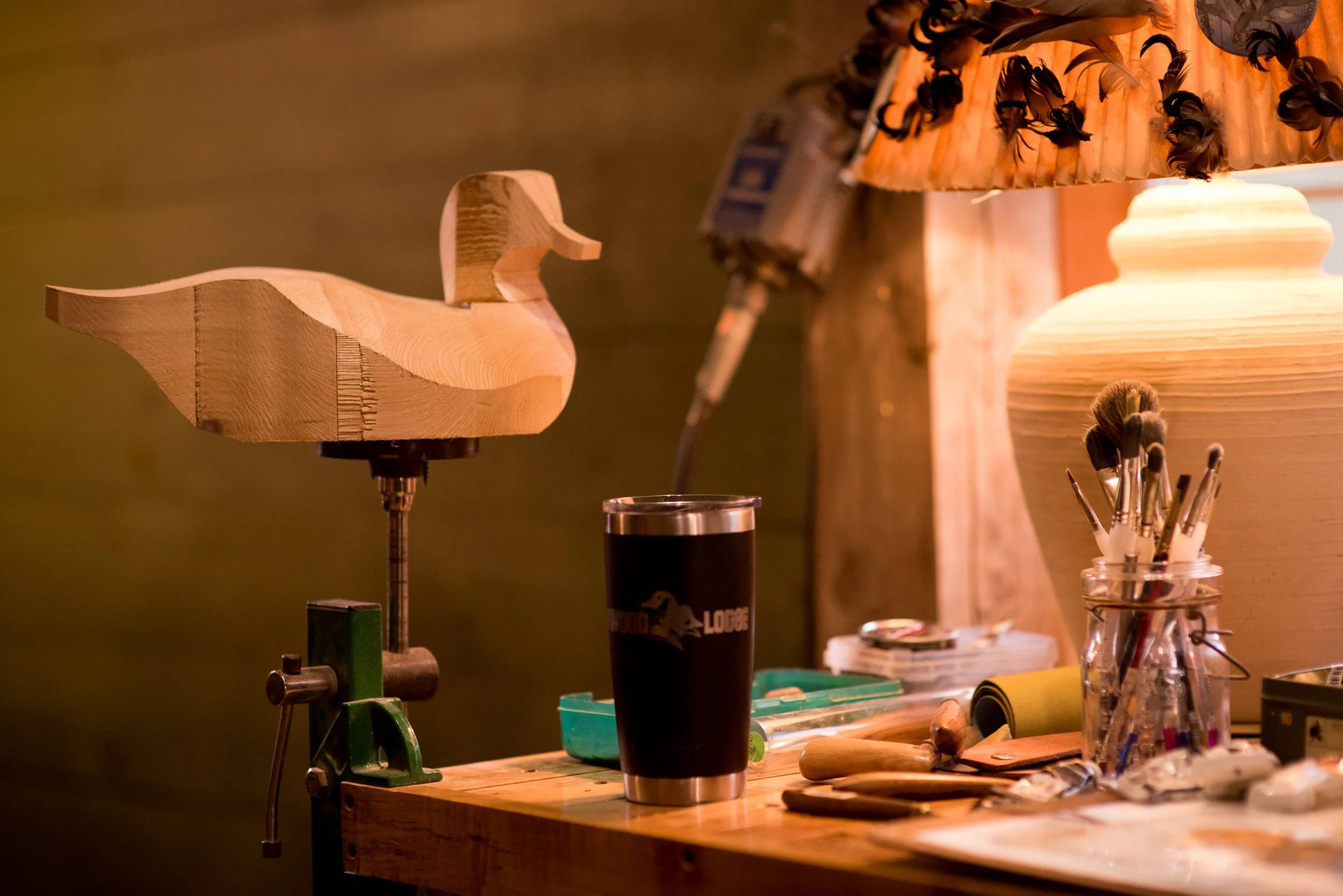  A rough cut out of a wood duck decoy on the work bench of a decoy carver 
