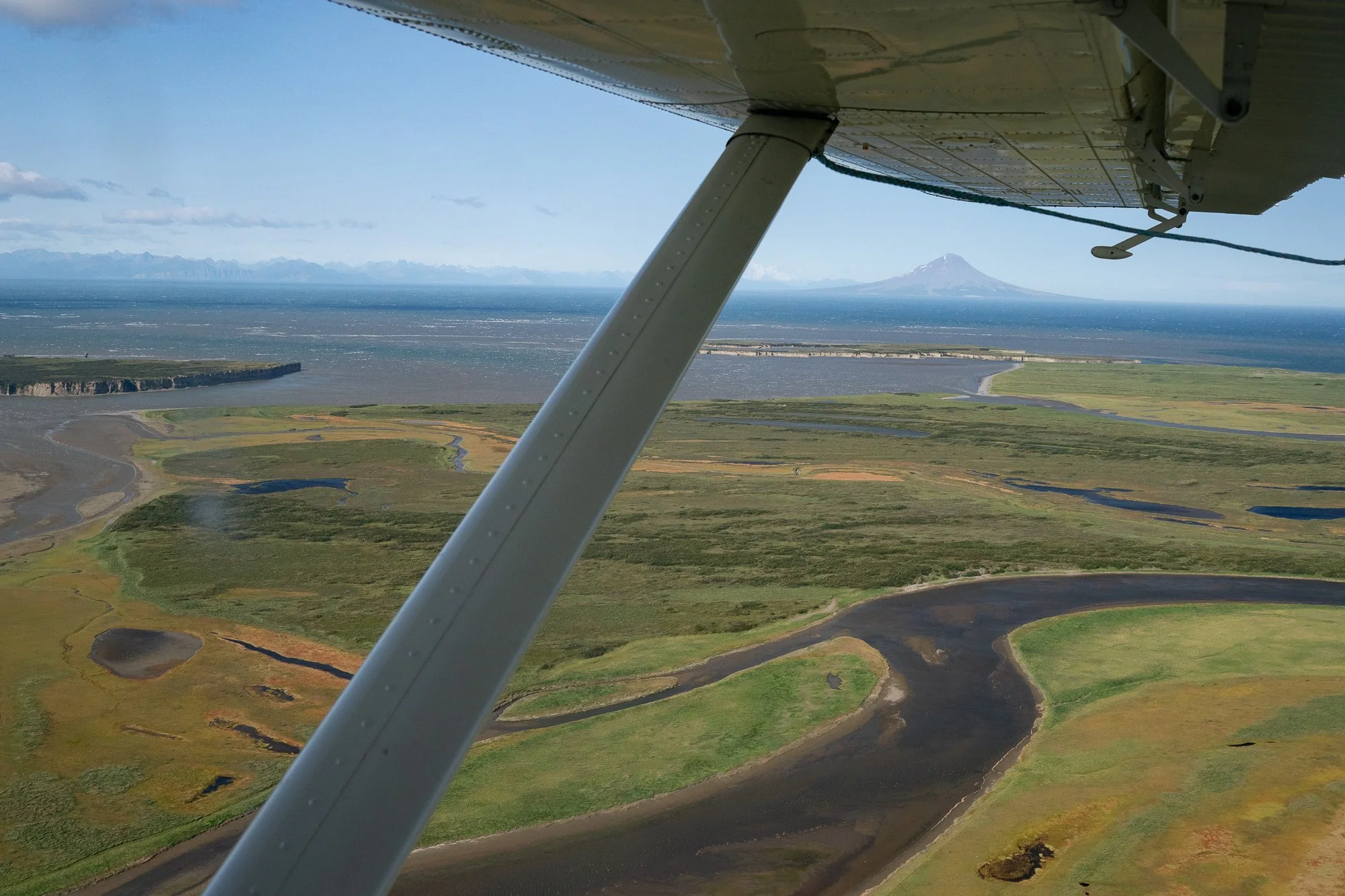 Braided river winding through the Alaskan landscape viewed from a float plane