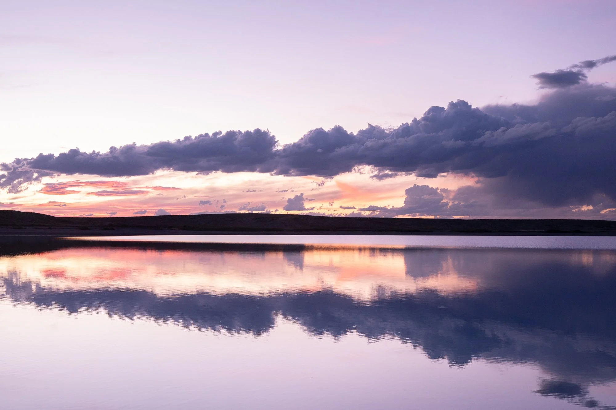 sunset lake reflection nature photography print with warm light mirrored across still water