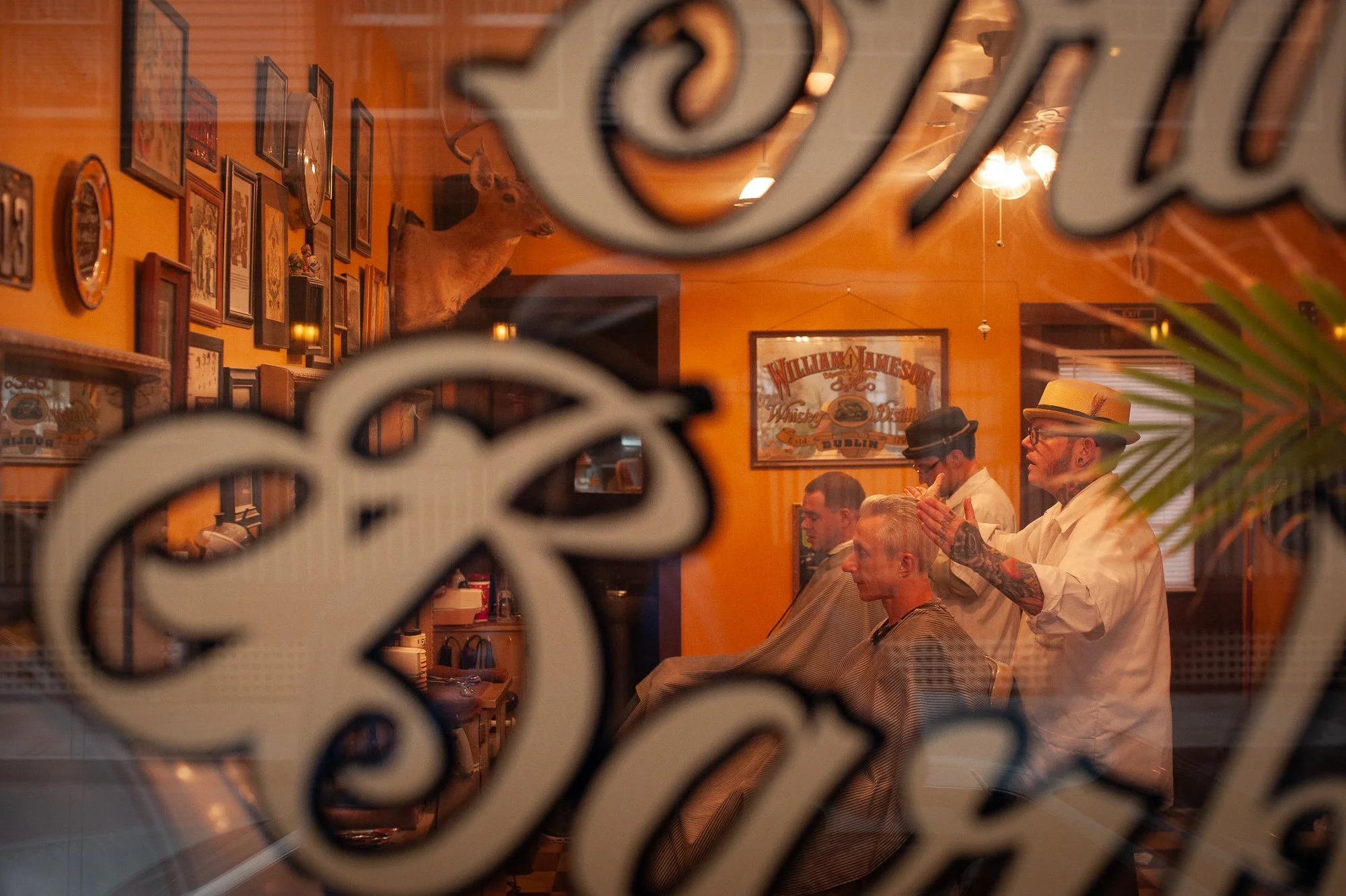 Vintage taxidermy and barber shop details fill the interior of Pugsly’s SideShow in Kingston, New York.