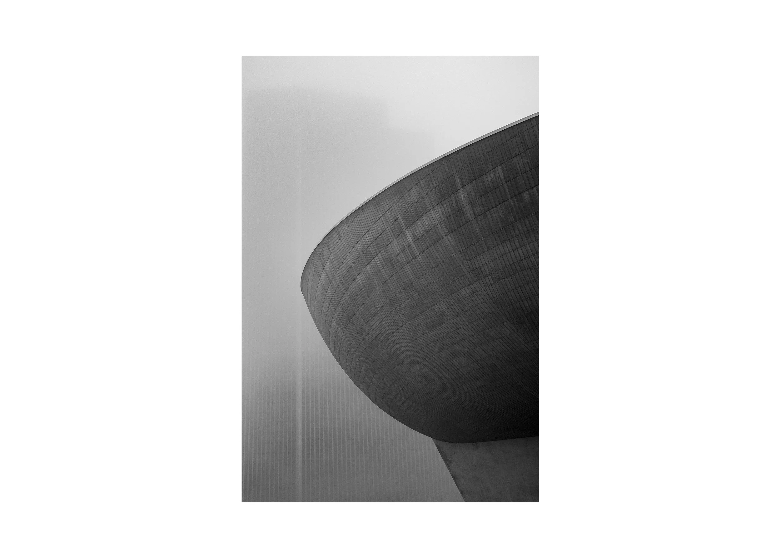 Black and white photograph of The Egg performing arts center in Albany, New York, emphasizing its curved modernist architecture