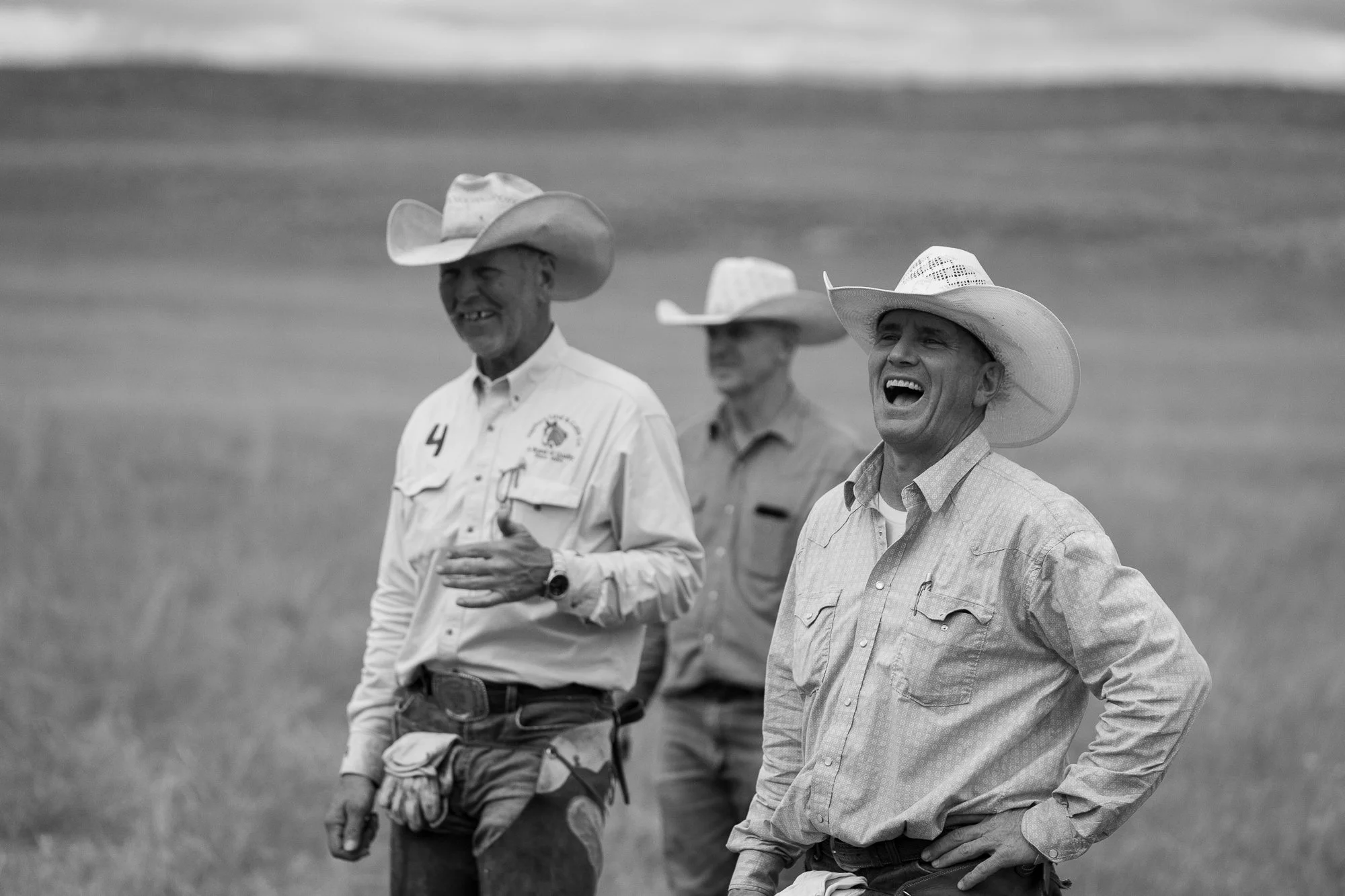 Two cowboys laugh together during a break in the work at Haythorn Ranch in Nebraska.