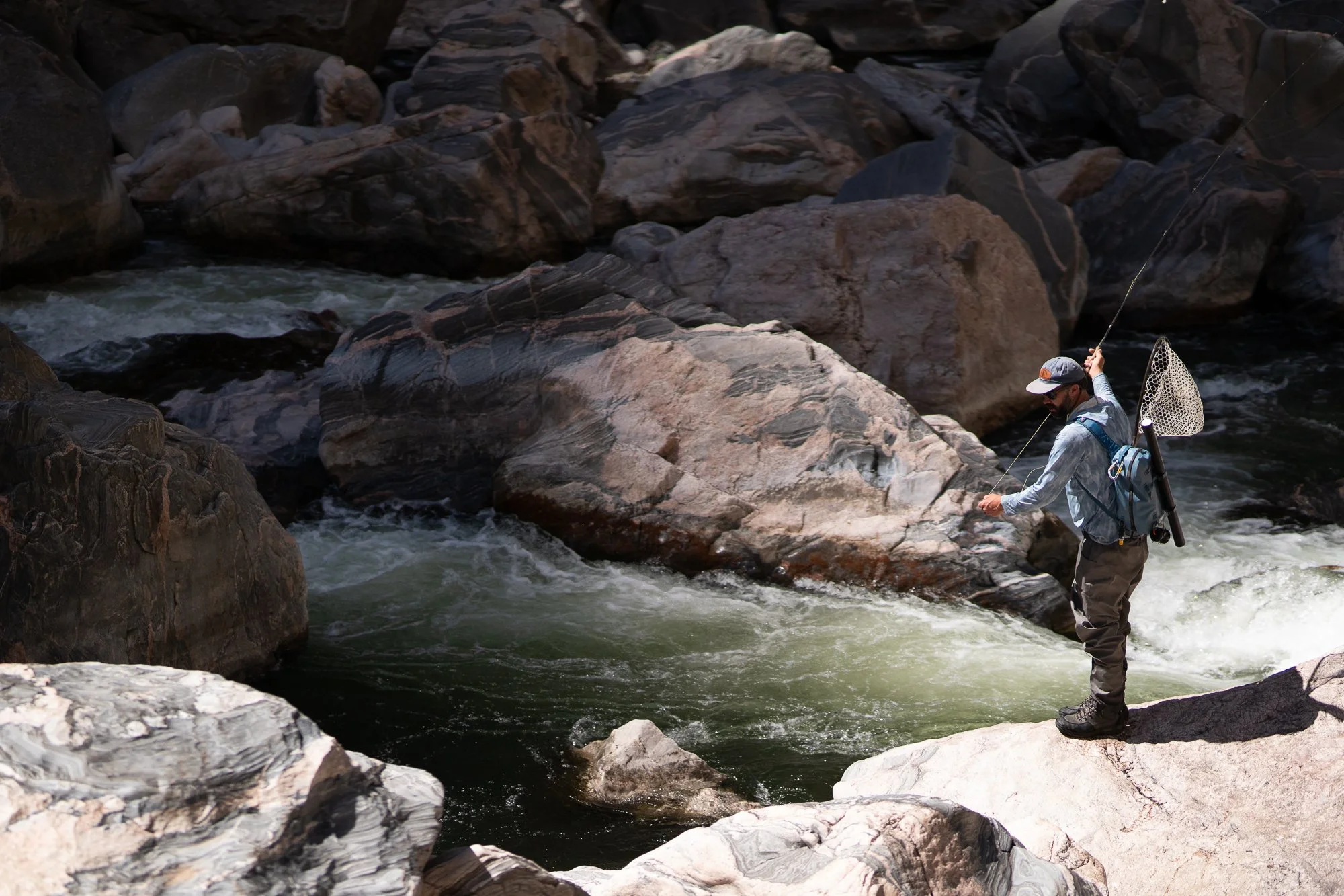 A fly angler casts into technical pocket water in the Black Canyon of the Gunnison