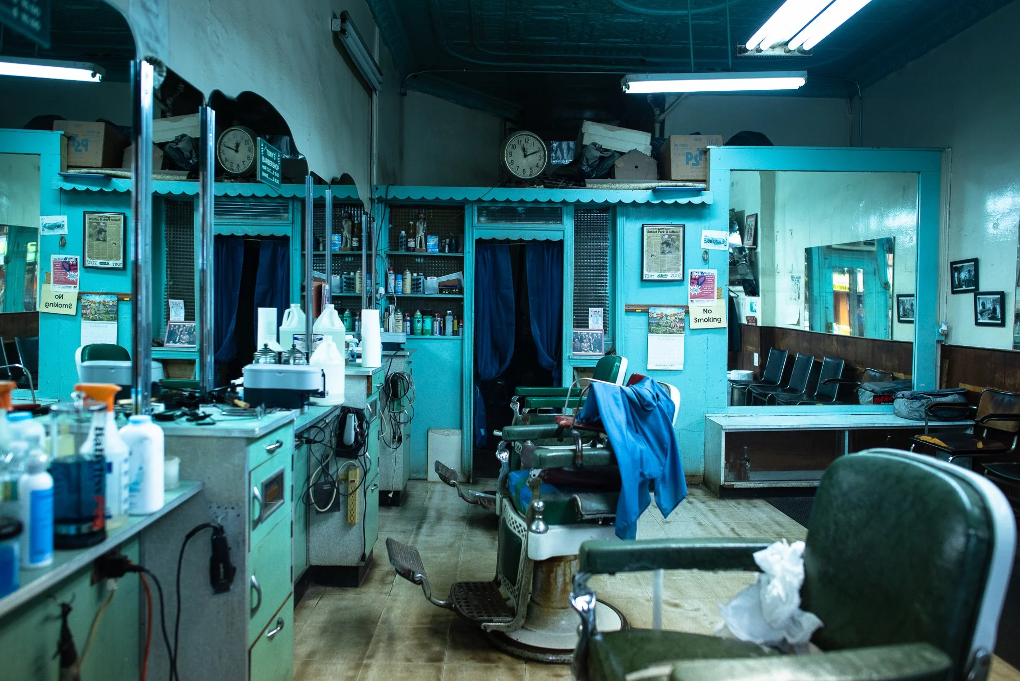 Barber chairs and workstations lined up inside Tony’s Barbershop in Brooklyn, New York.