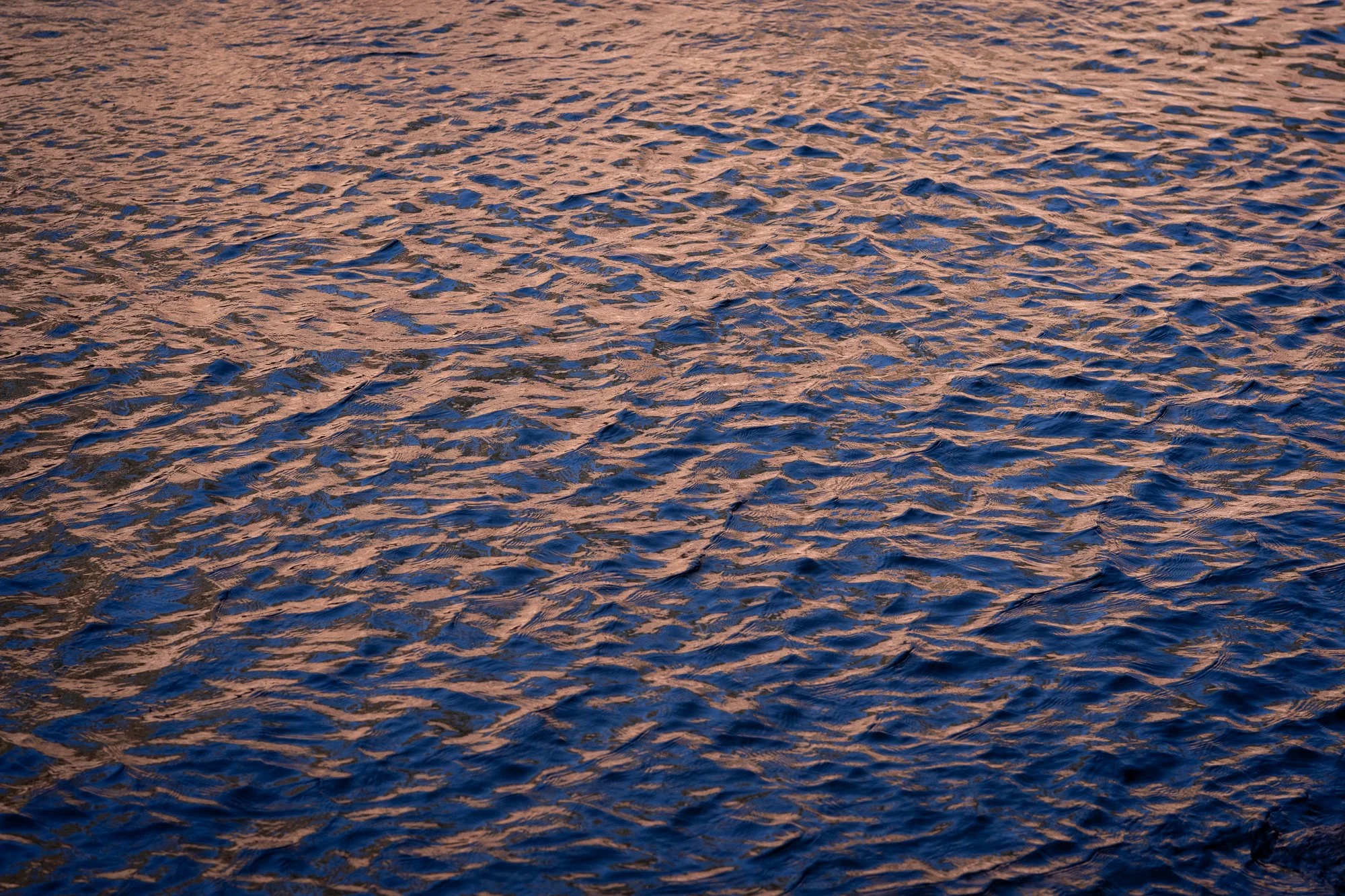 Textured water with reflected light on the South Platte River near Deckers, Colorado