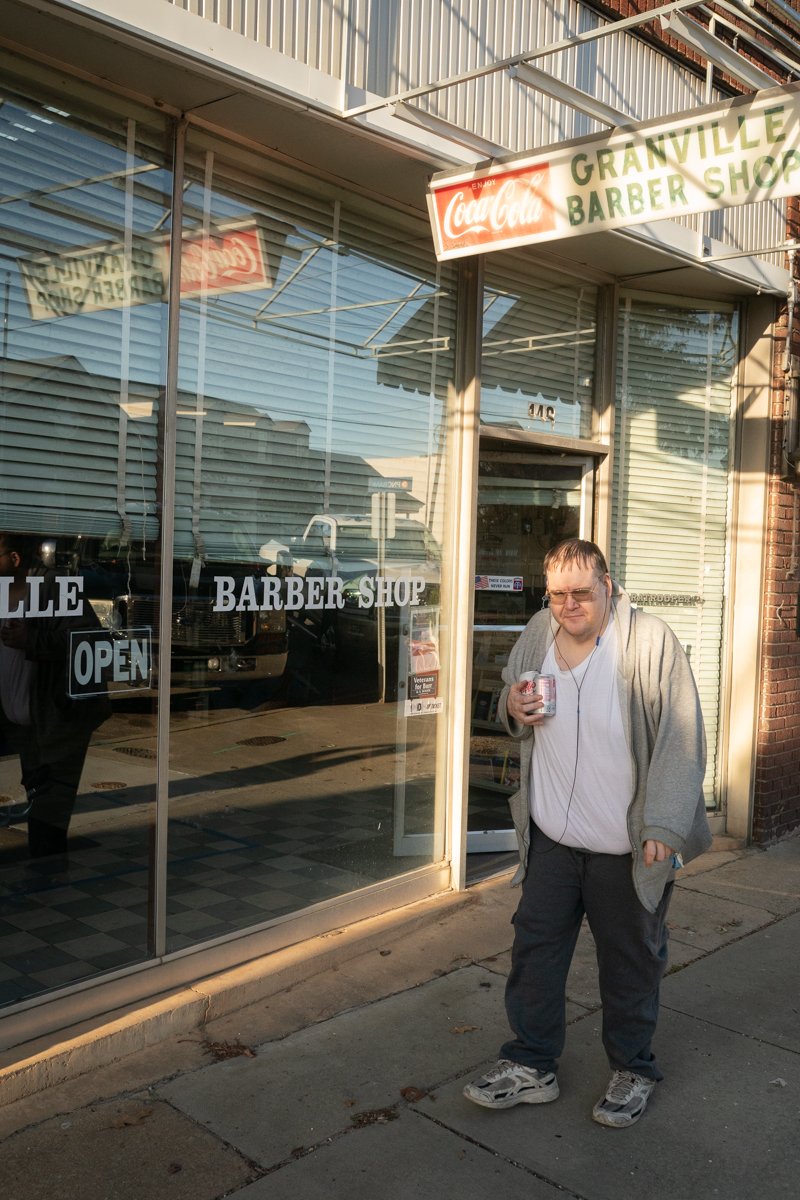 Exterior of Granville Barbershop in Granville, North Carolina with classic signage and storefront windows