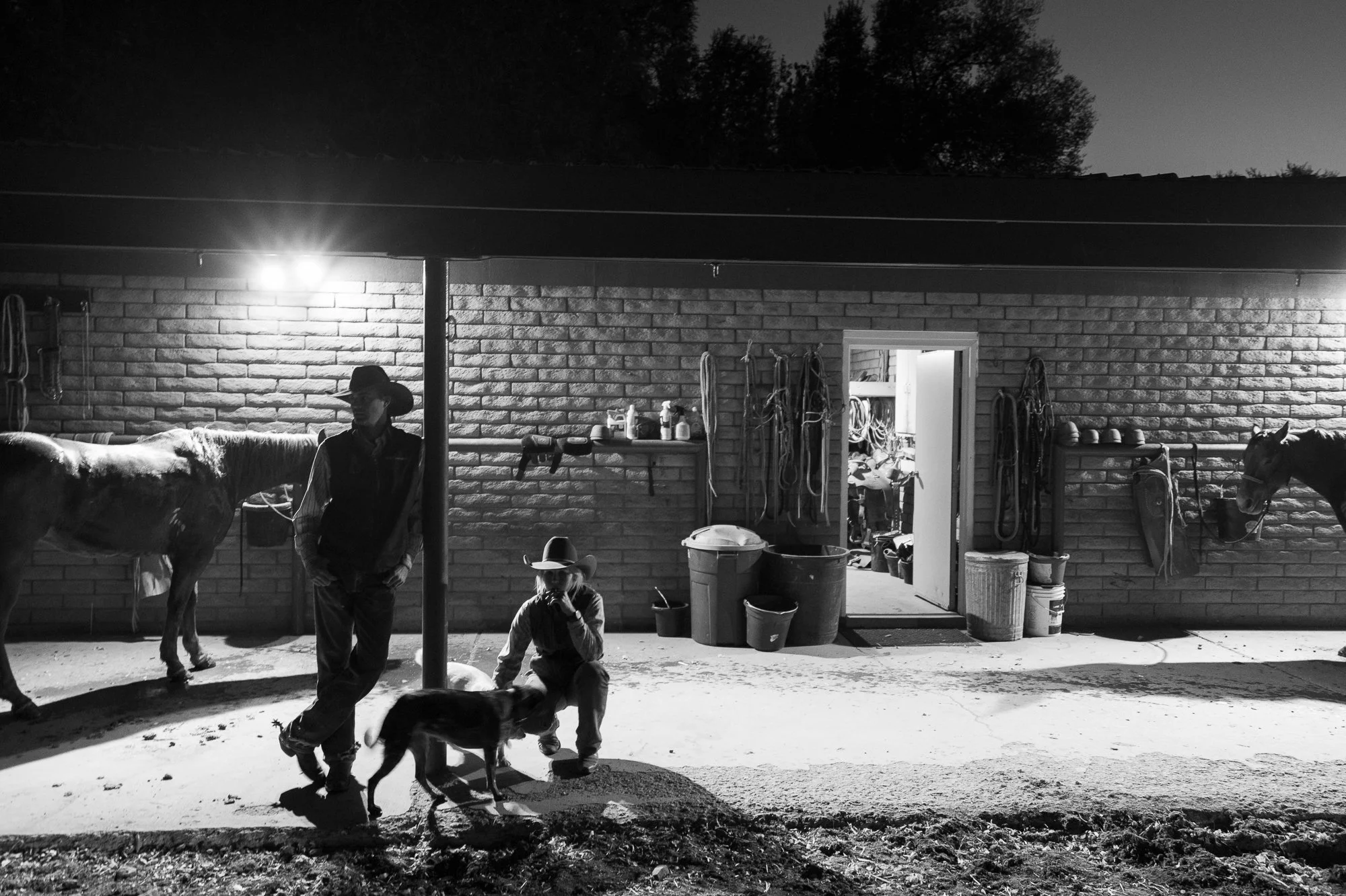 Black and white photograph of husband and wife cowboys