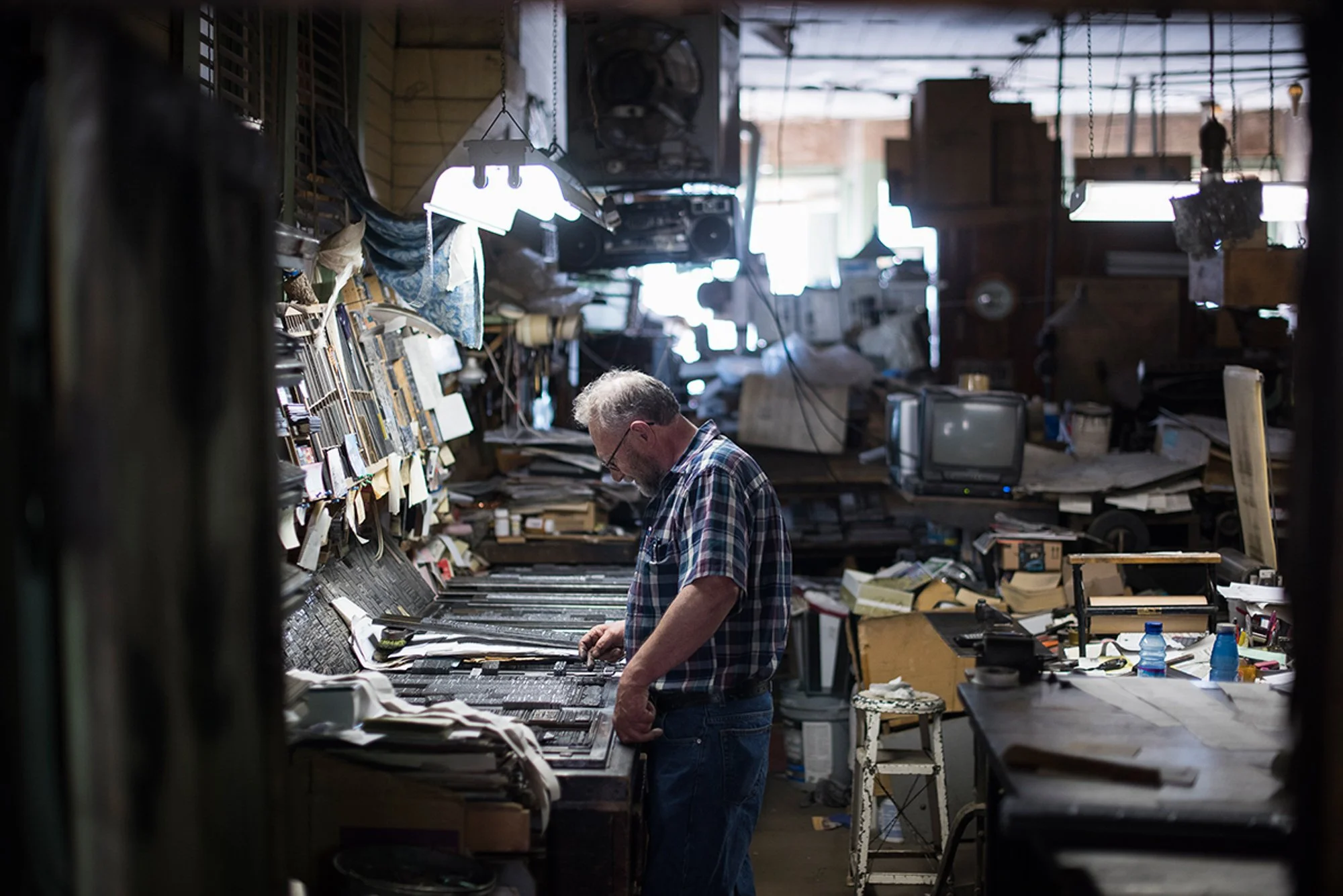 Dean Coombs working inside the Saguache Crescent print room