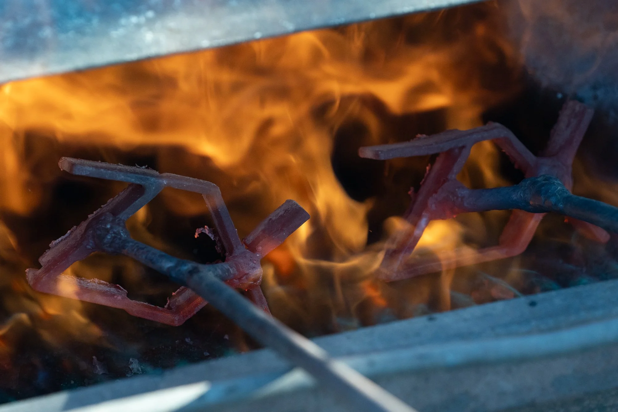 Branding irons heat over an open fire during cattle work at the ZX Ranch near Paisley, Oregon