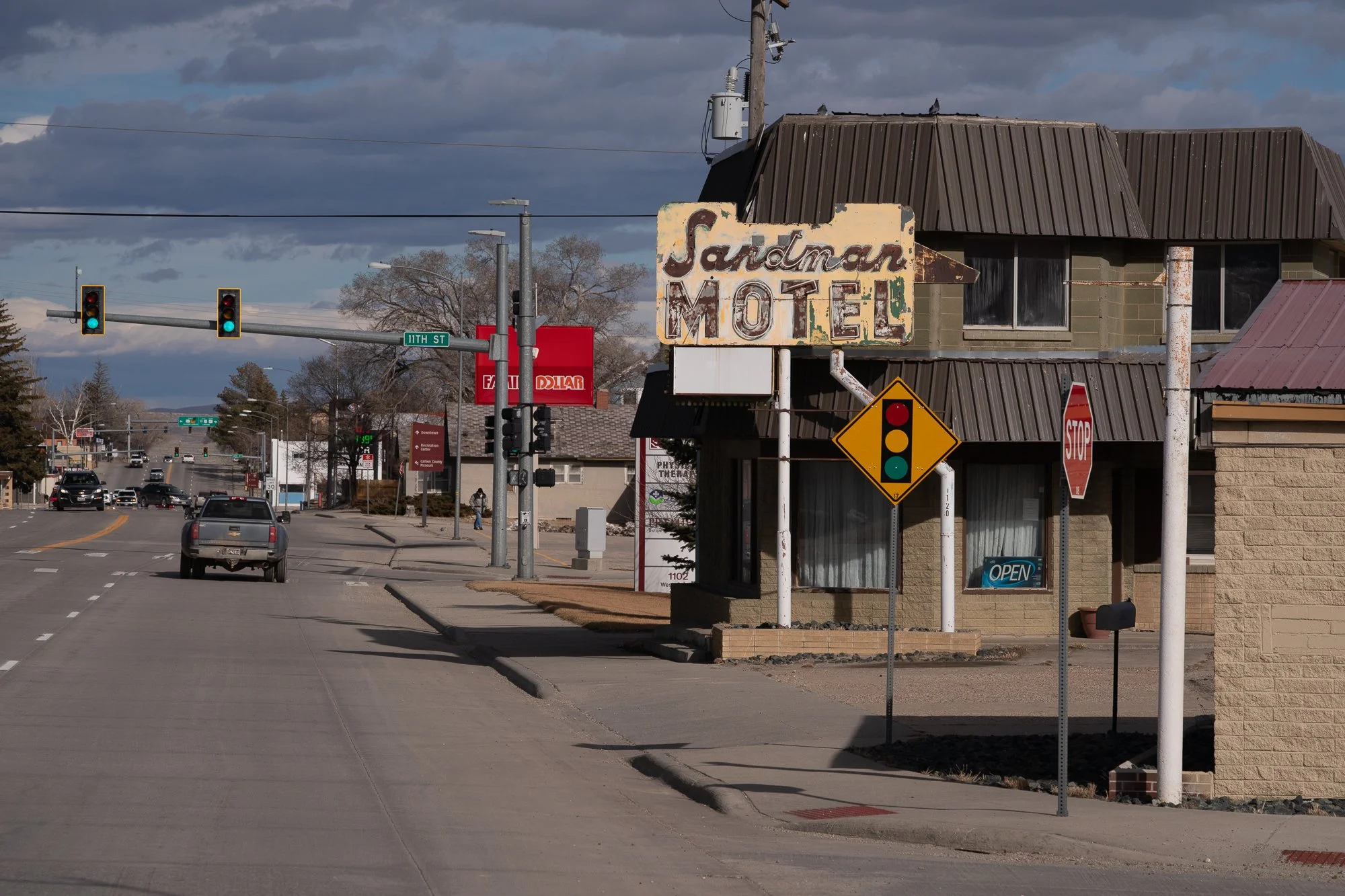 Sandman Motel sign and storefront along a Wyoming street