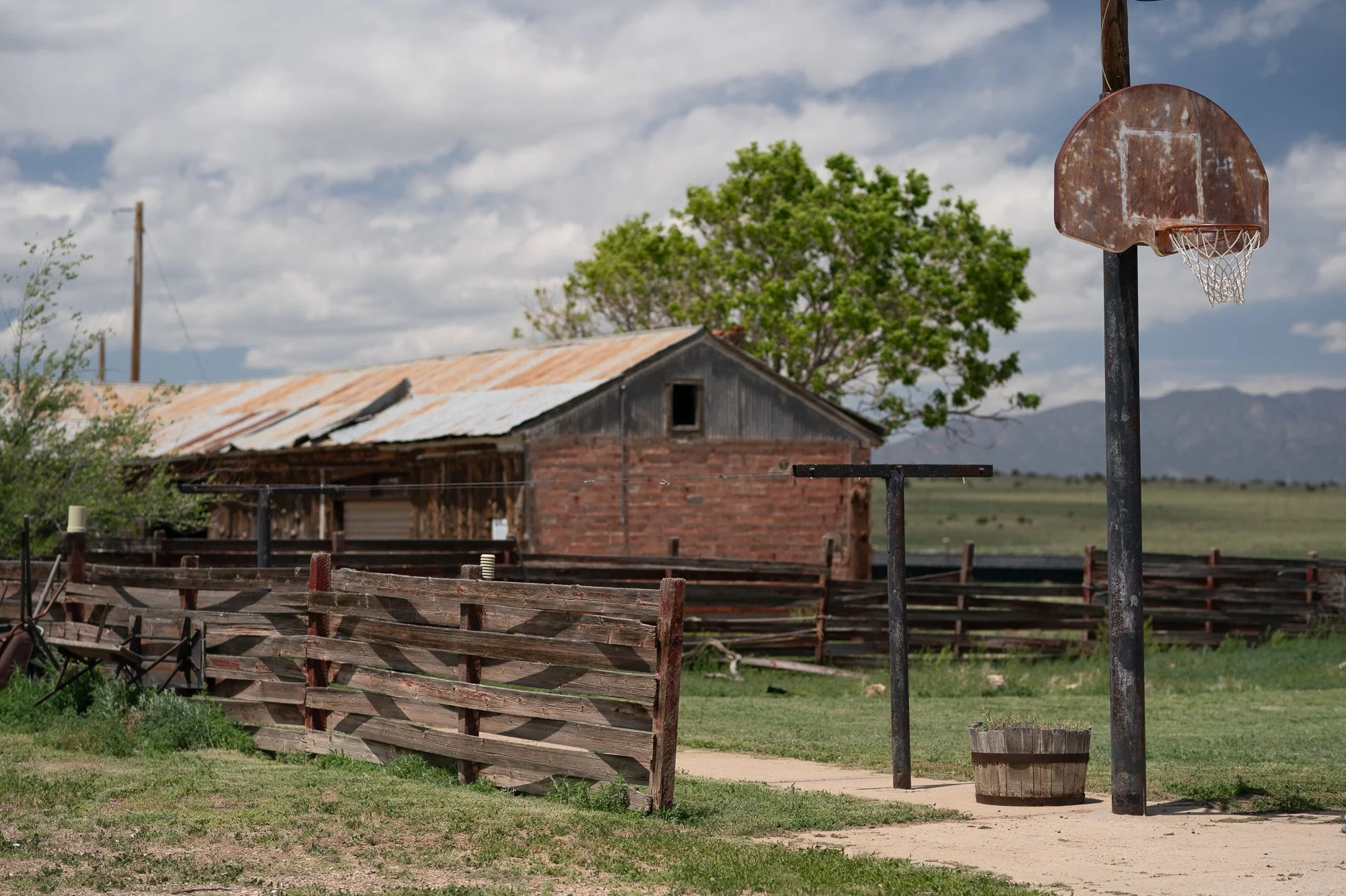 A basketball hoop hung on a poll on an old ranch in Colorado