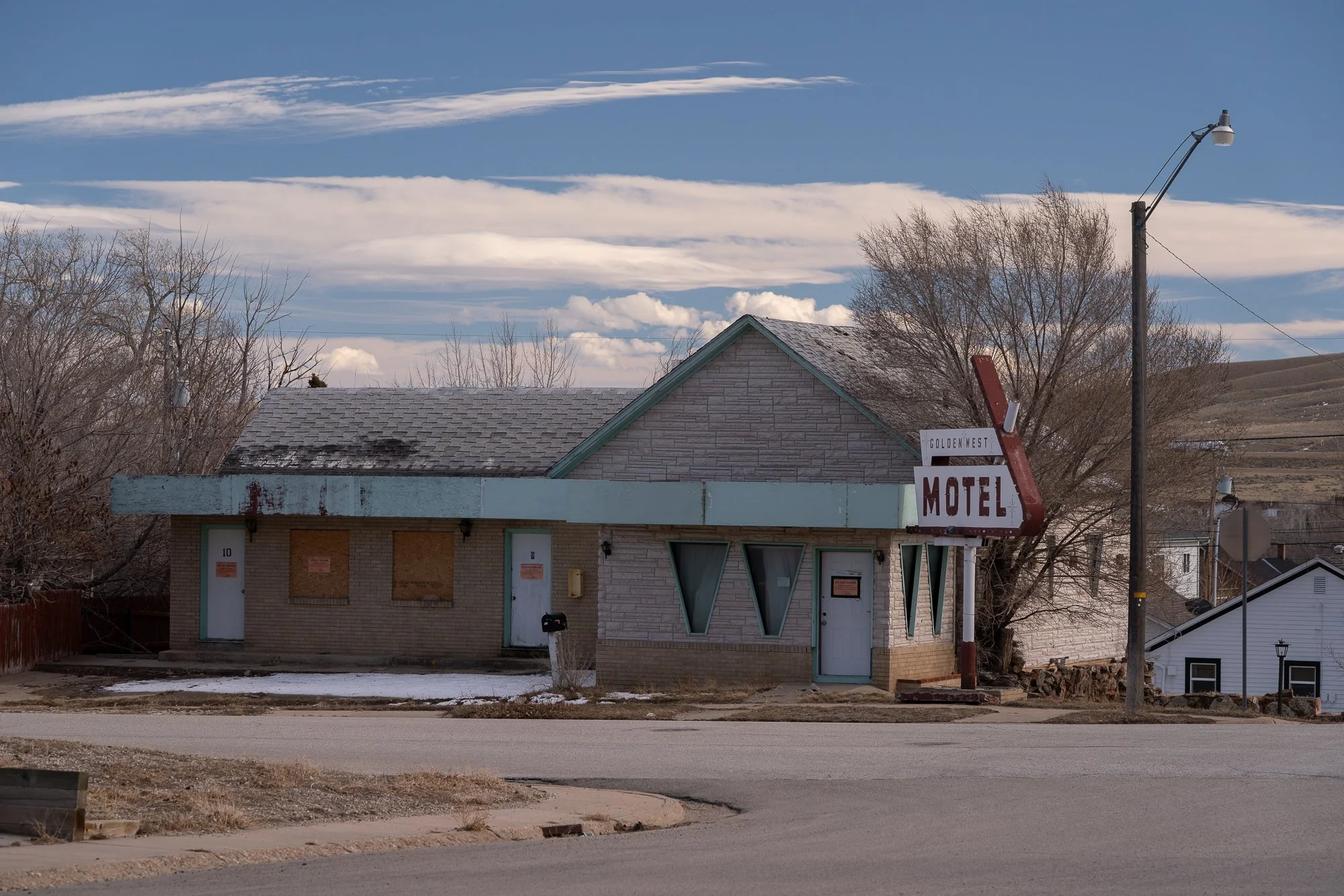 Golden West Motel sign and weathered building in a Wyoming town