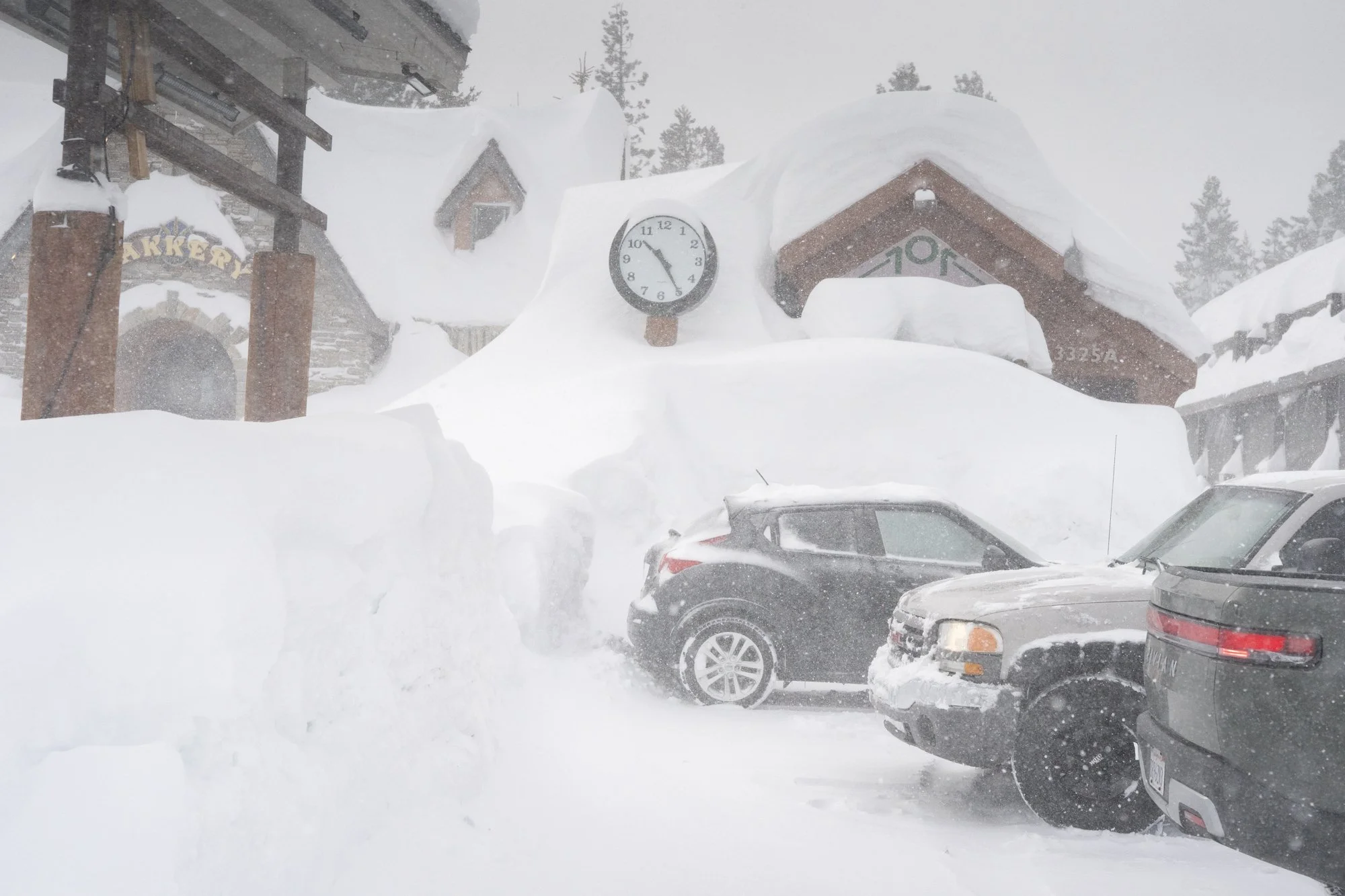 Schat's Bakery and other local businesses covered in snow after a massive winter storm in Mammoth Lakes, California