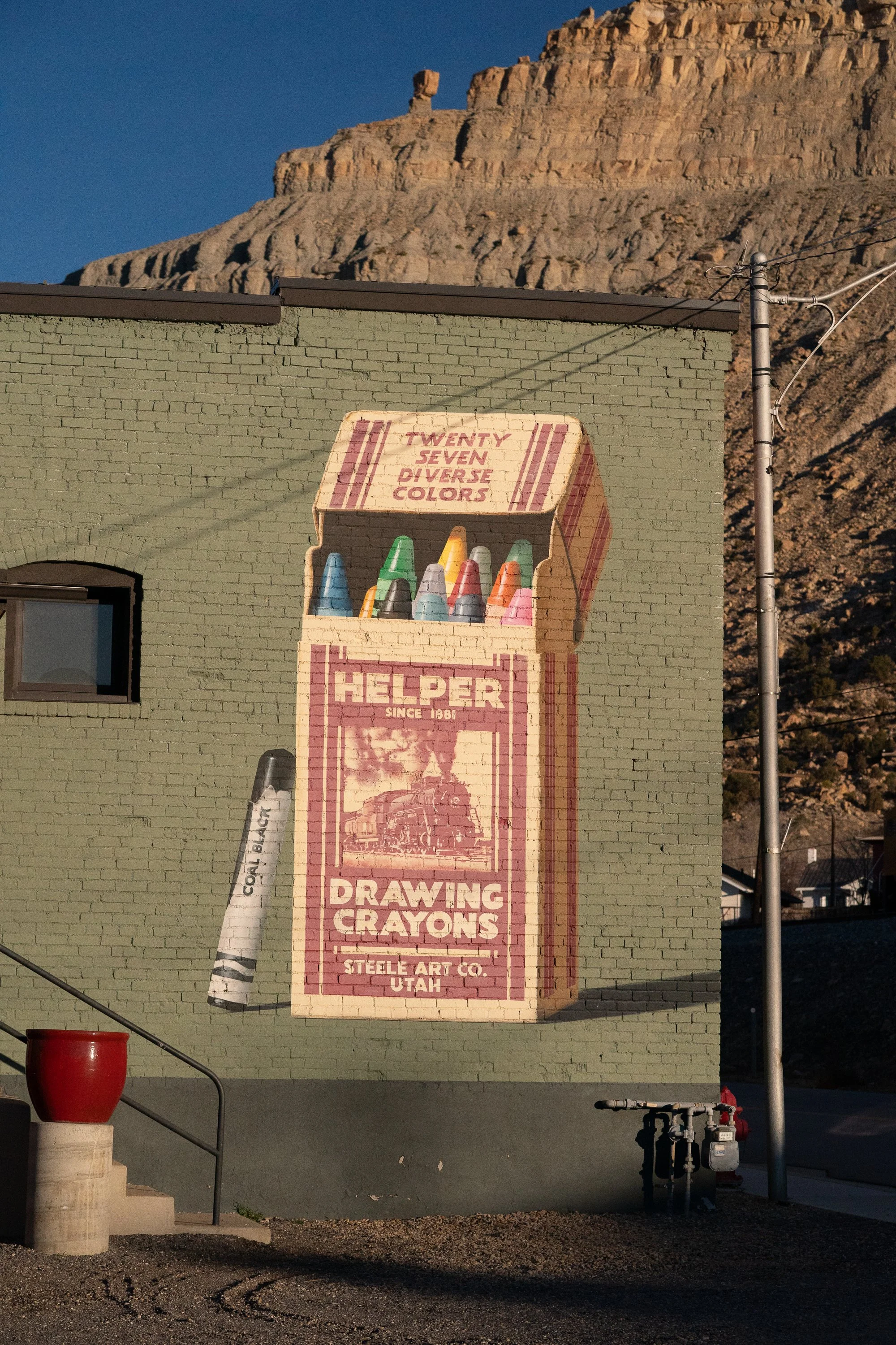 Helper Drawing Crayons mural painted on brick wall in Helper Utah