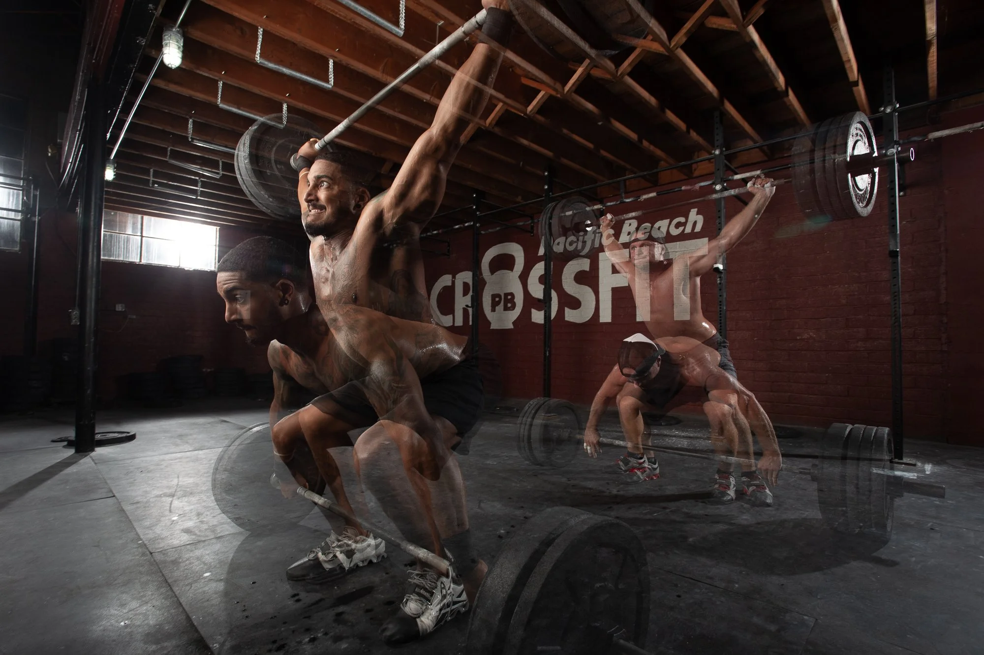 multiple exposure fitness photography of athlete performing barbell lift in CrossFit gym environment