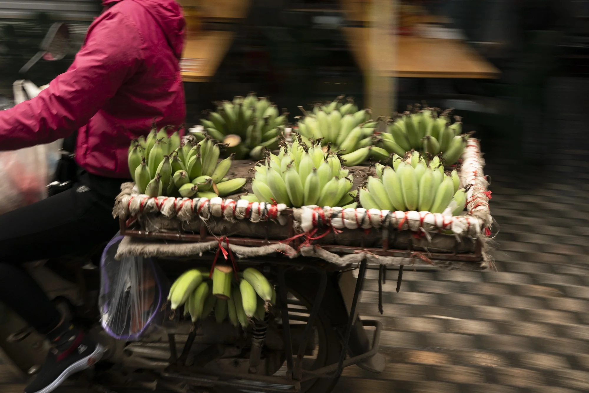 Stock photograph of a street food vendor a bicycle in Hanoi, Vietnam
