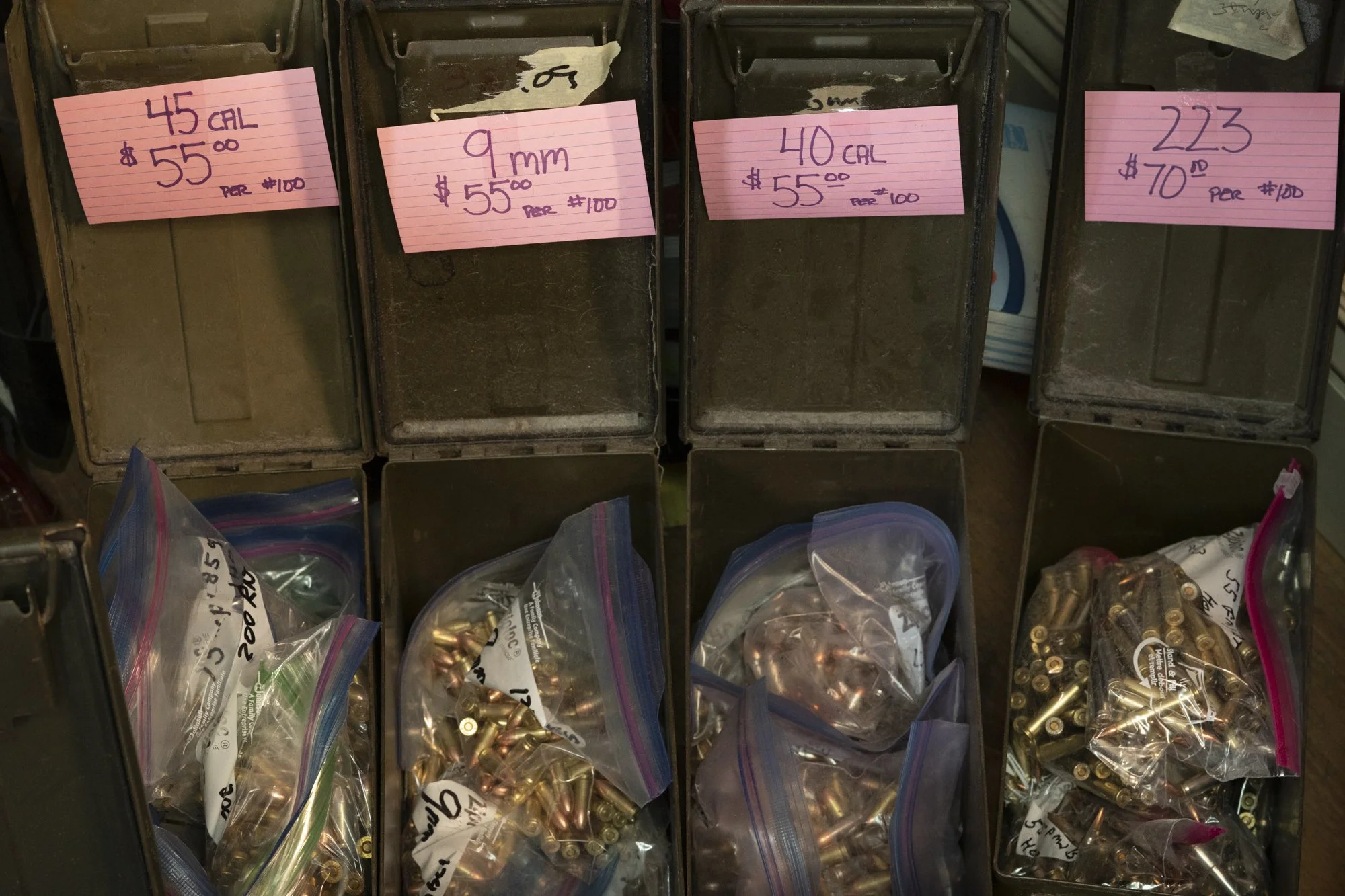 Ammunition for sale on the counter of an old-school barbershop, reflecting rural Americana and local culture.
