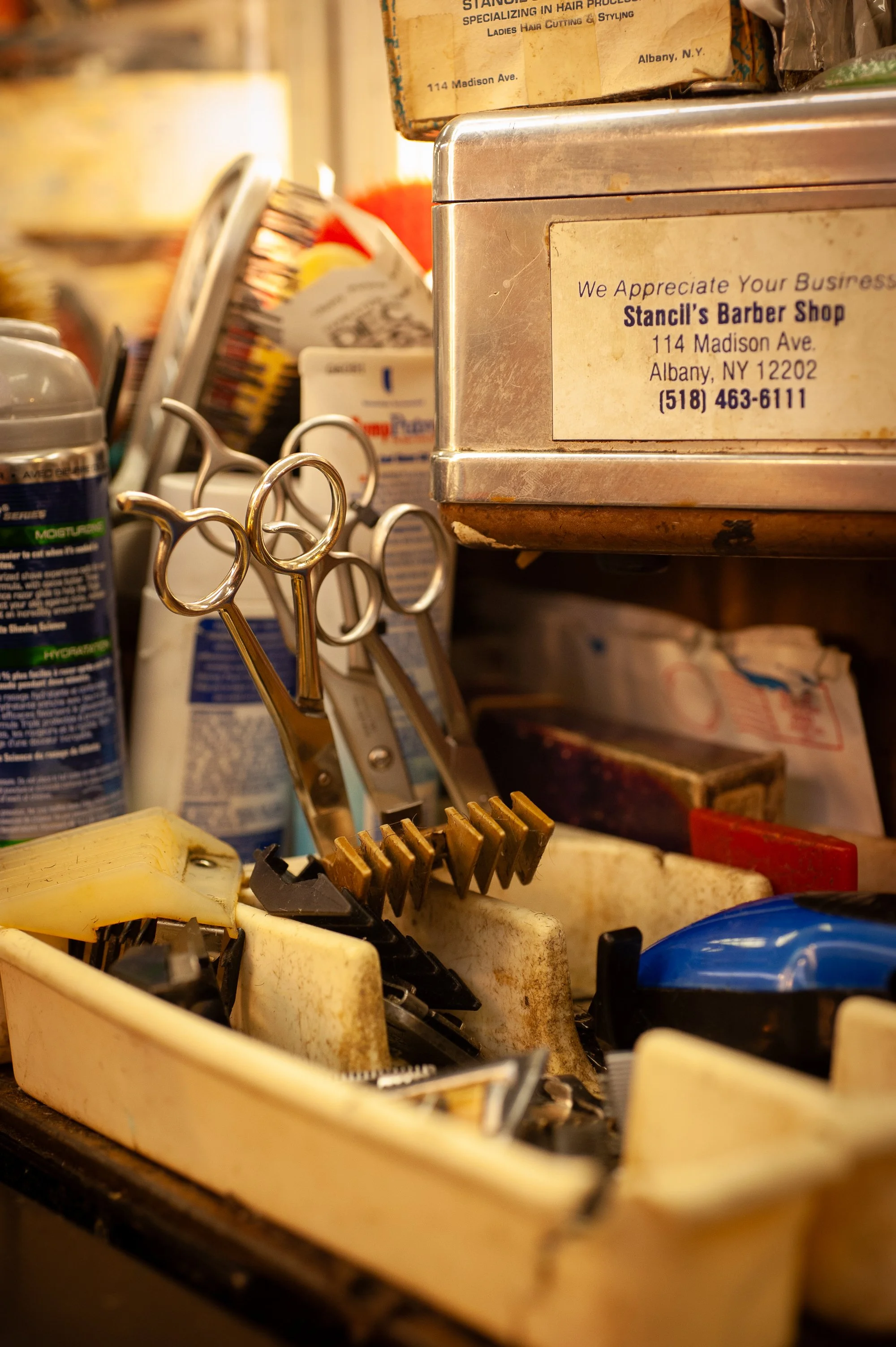 Close up of barber tools scissors combs clippers inside Stancil’s Barbershop Albany New York 2011