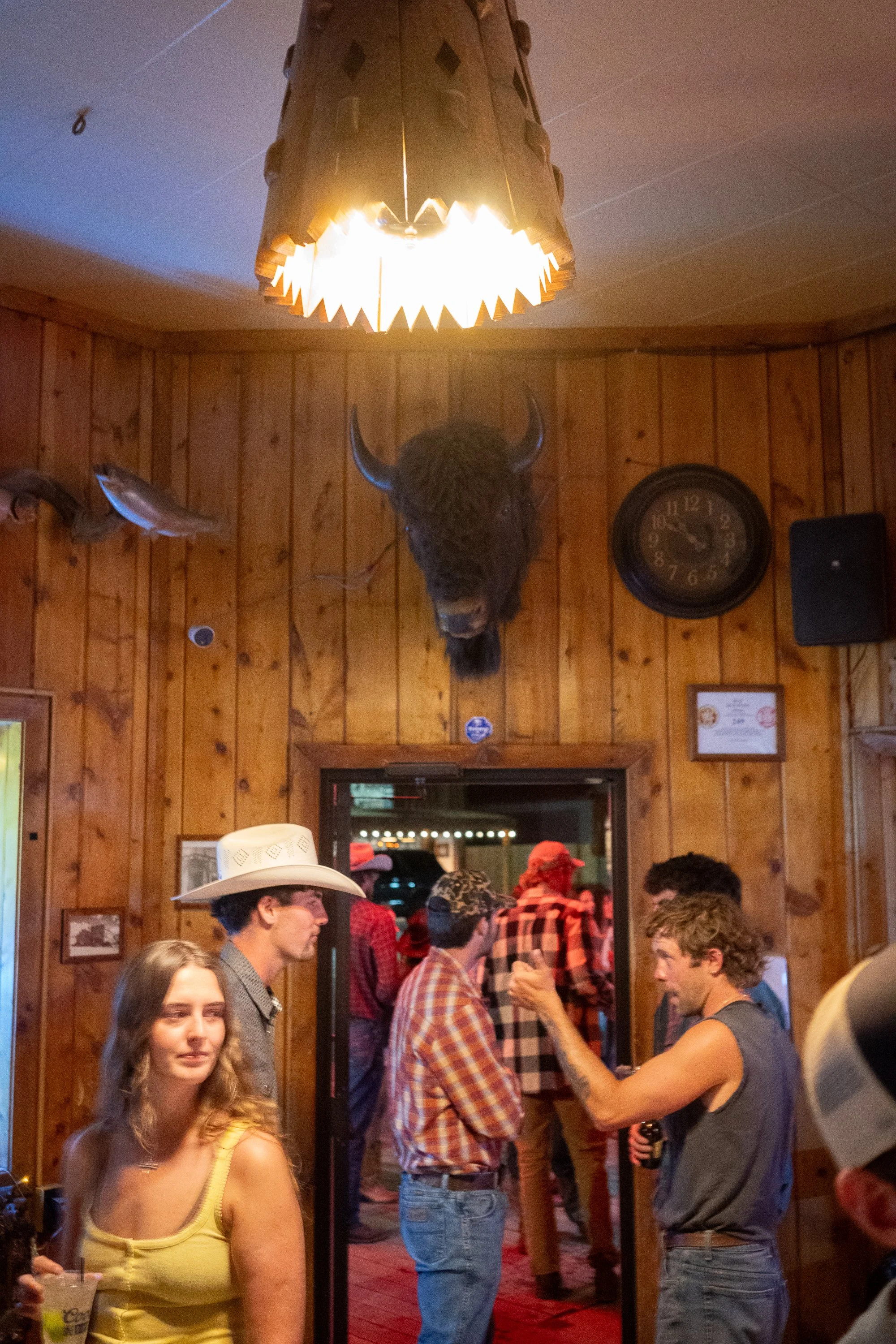 Patrons gather inside the Rustic Pine Tavern after the rodeo in Dubois Wyoming