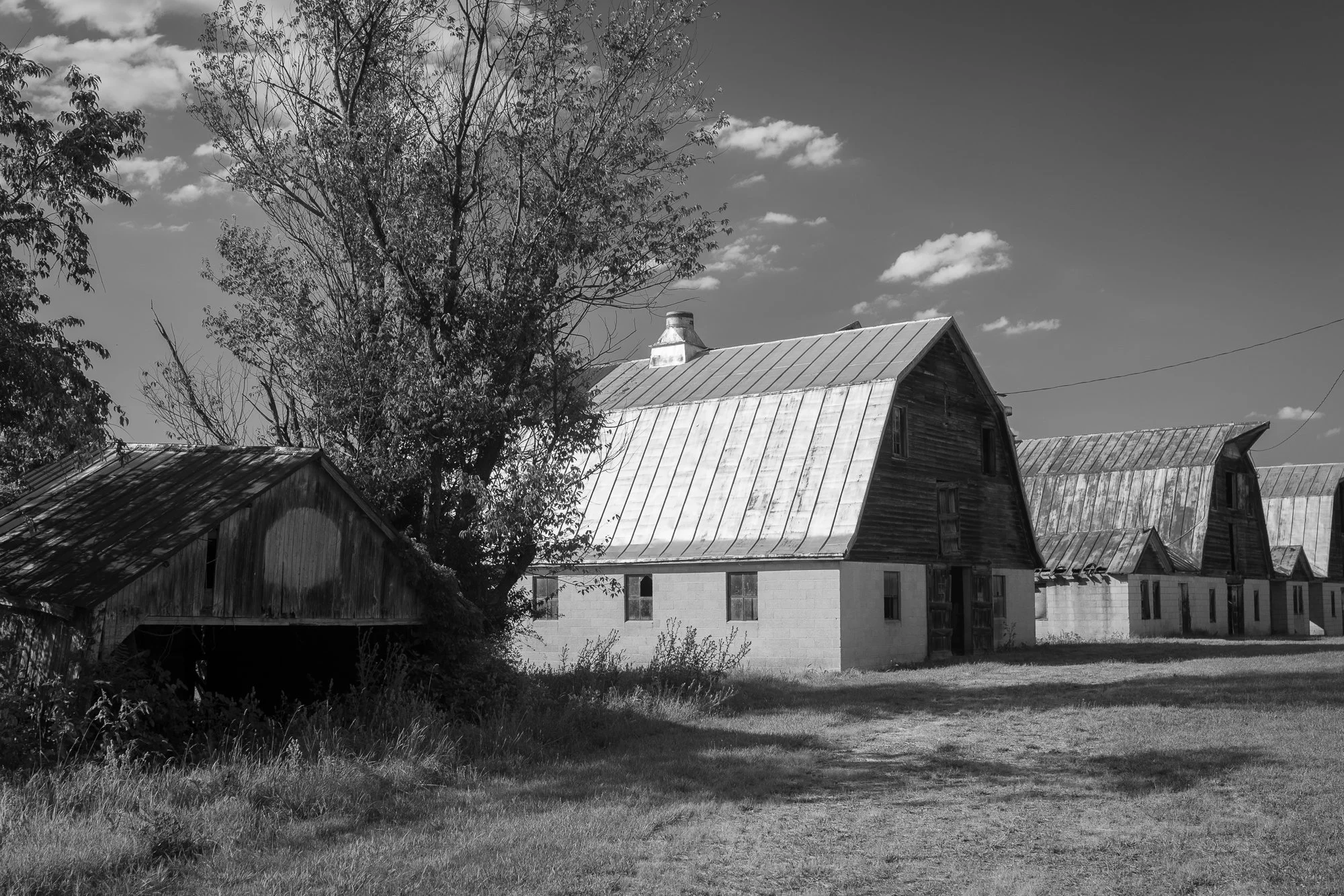 The outline where a basketball hoop once hung on a barn in small town America