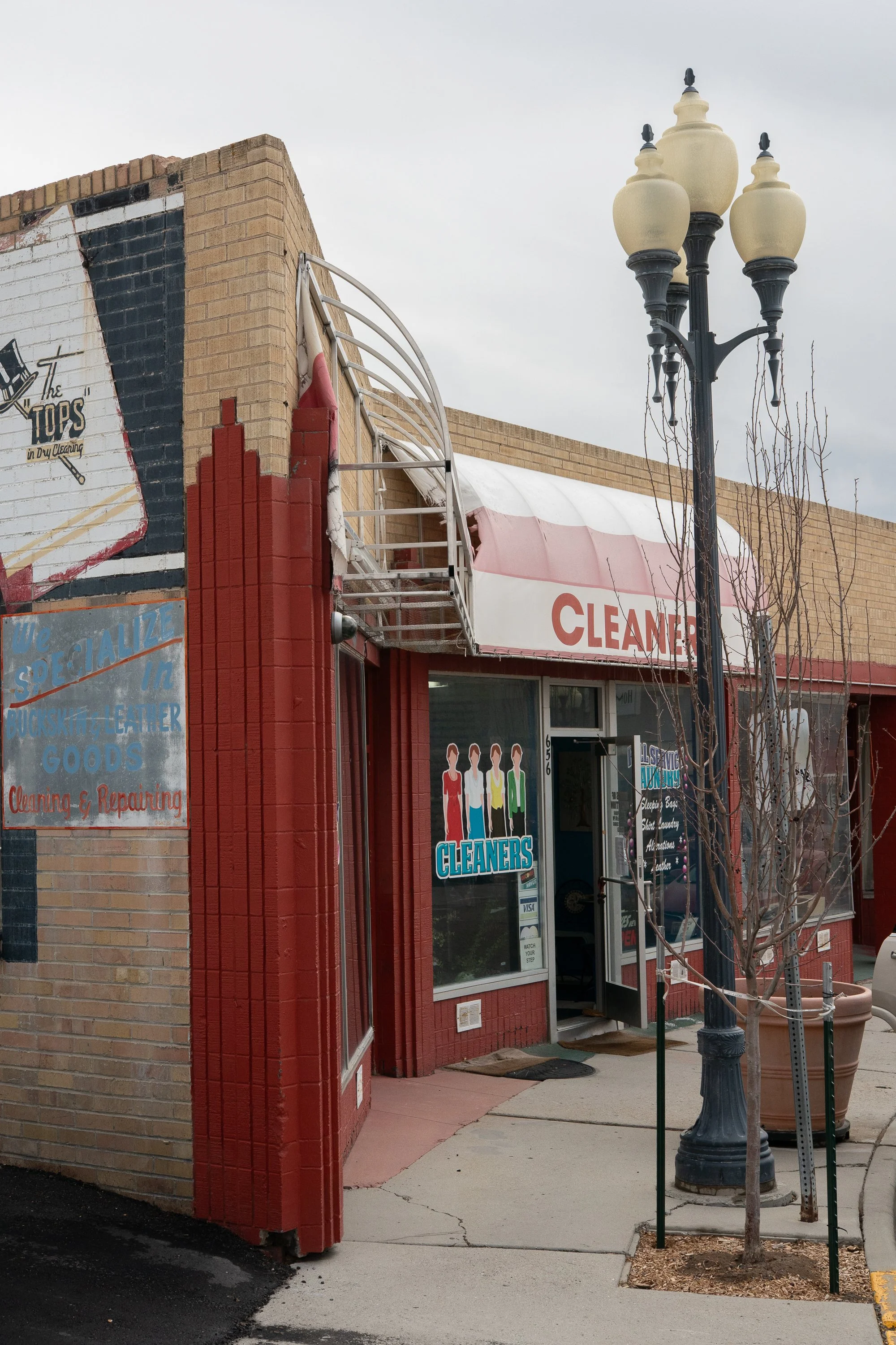 Neighborhood cleaners storefront on a street corner in downtown Rock Springs Wyoming
