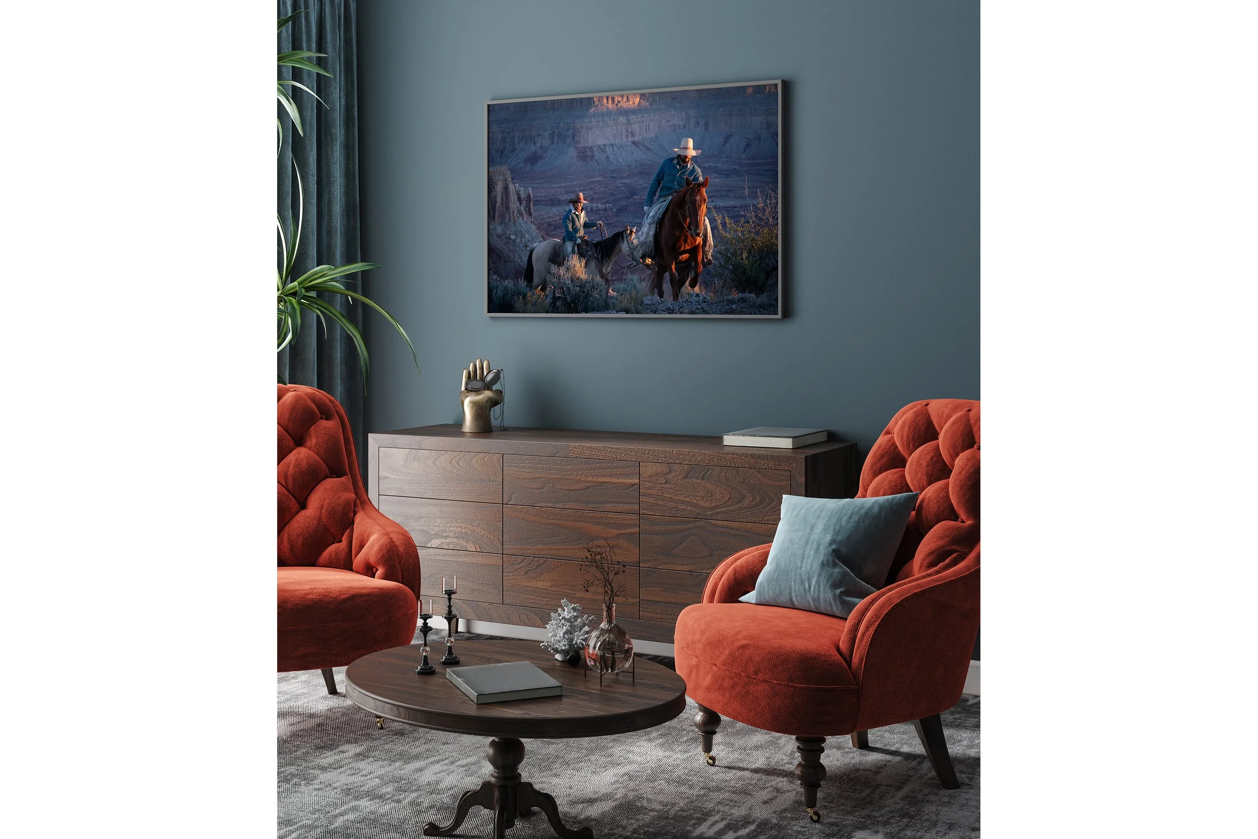 Western cowboy photography print displayed as wall art in a modern living room interior