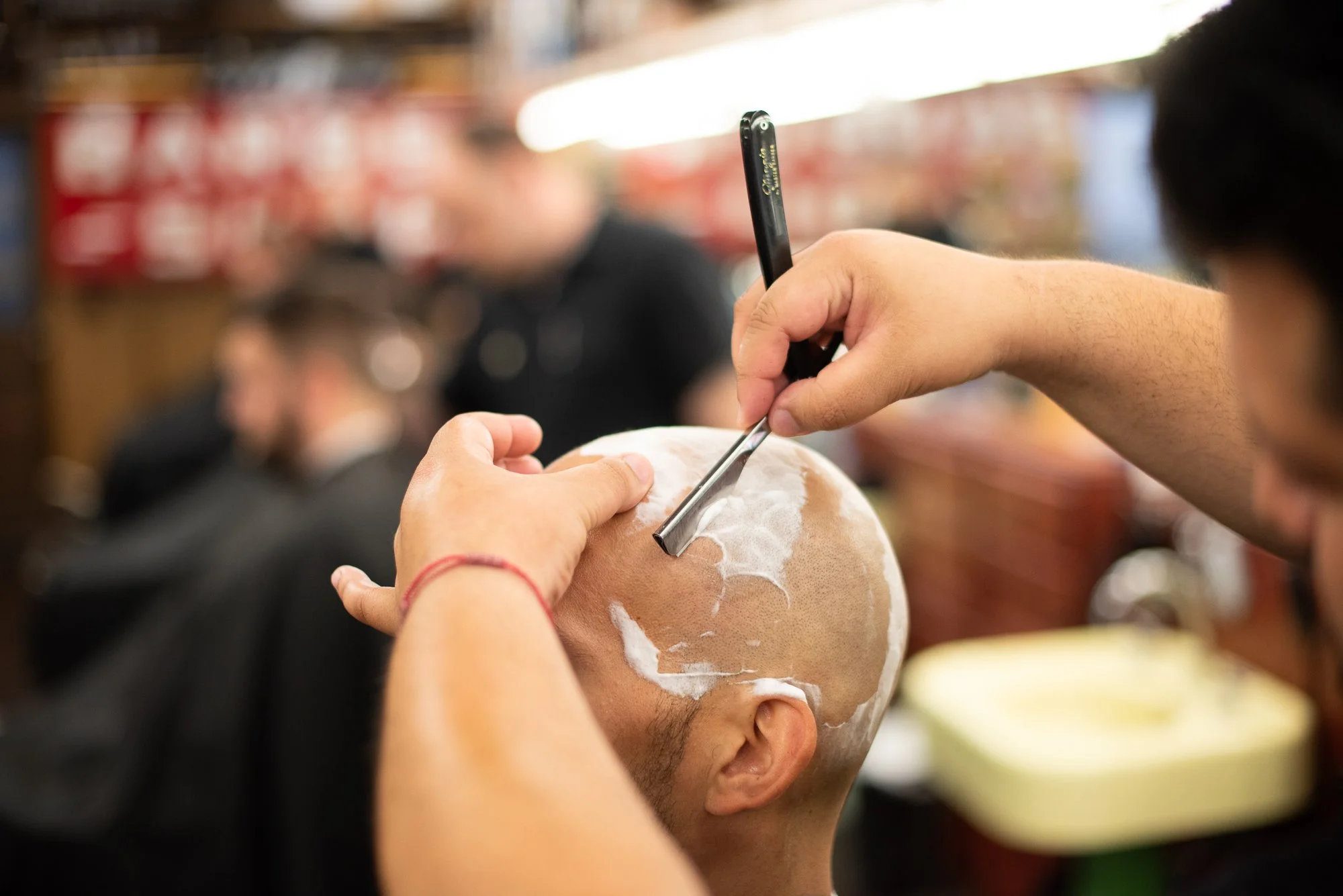 Straight razor shave in progress at Joe’s Barbershop in Chicago