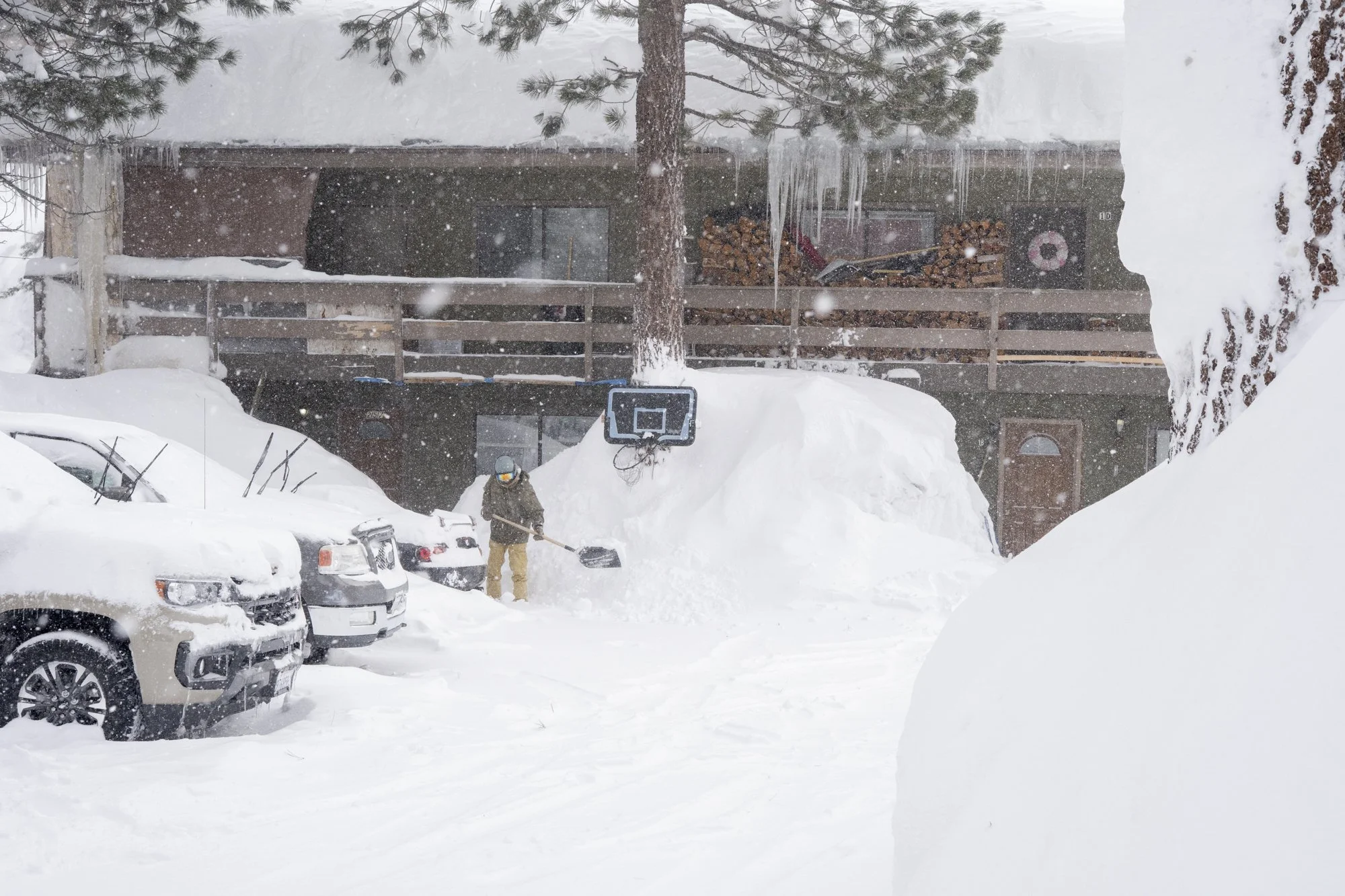A basketball hoop sits atop a massive pile of snow in Mammoth, California