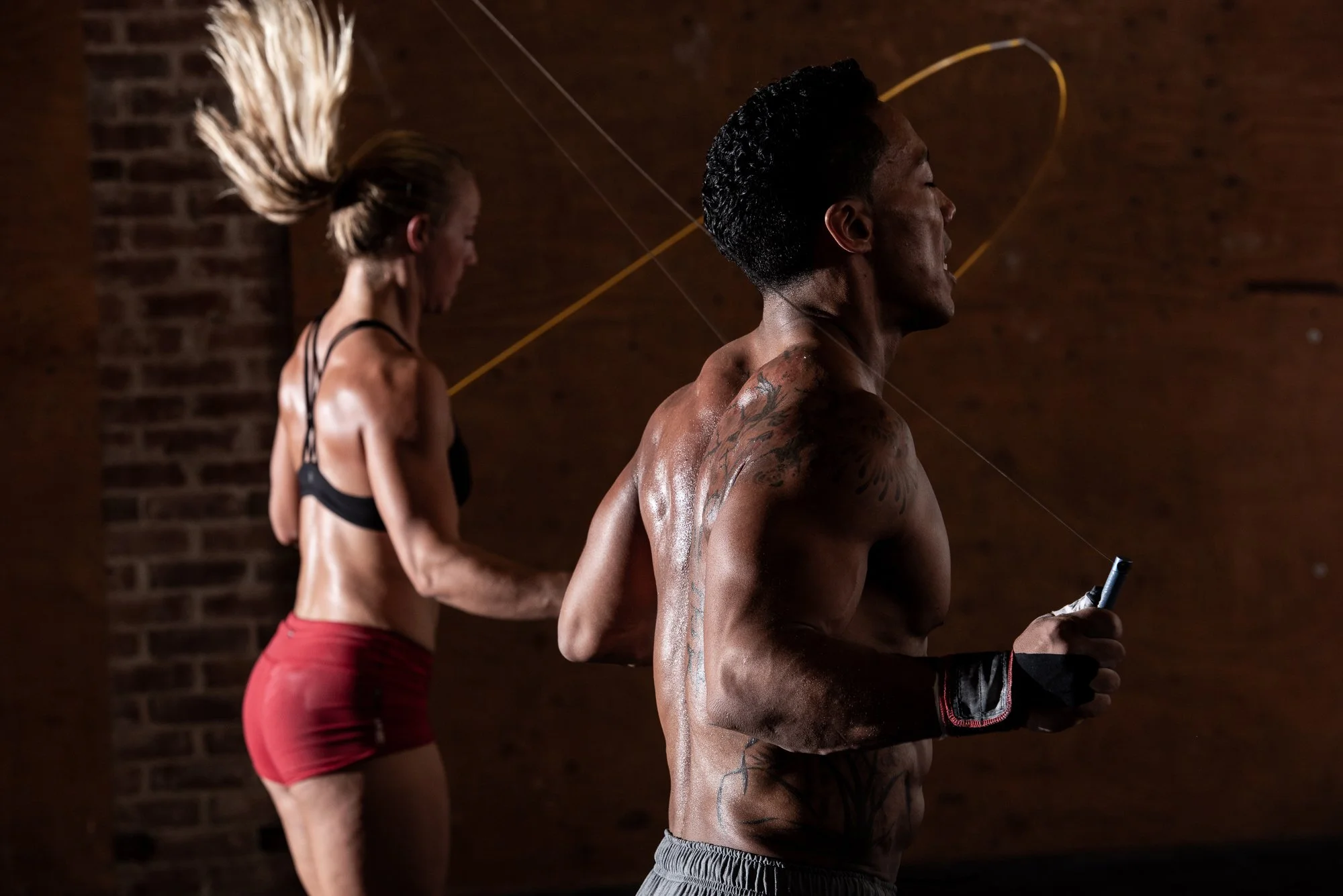 CrossFit athletes jumping rope during functional fitness training.