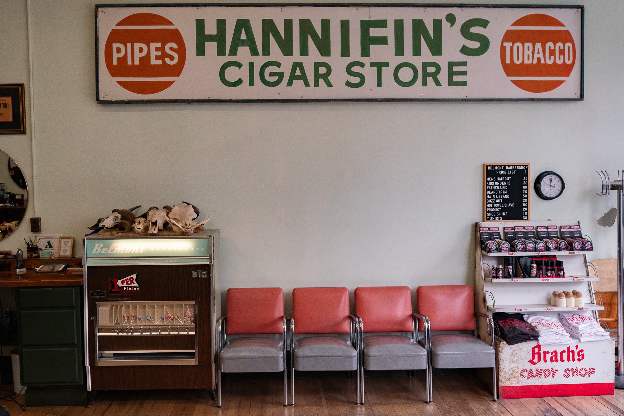 Hannifin’s Cigar Store sign above waiting chairs inside Belmont Barbershop in Boise Idaho