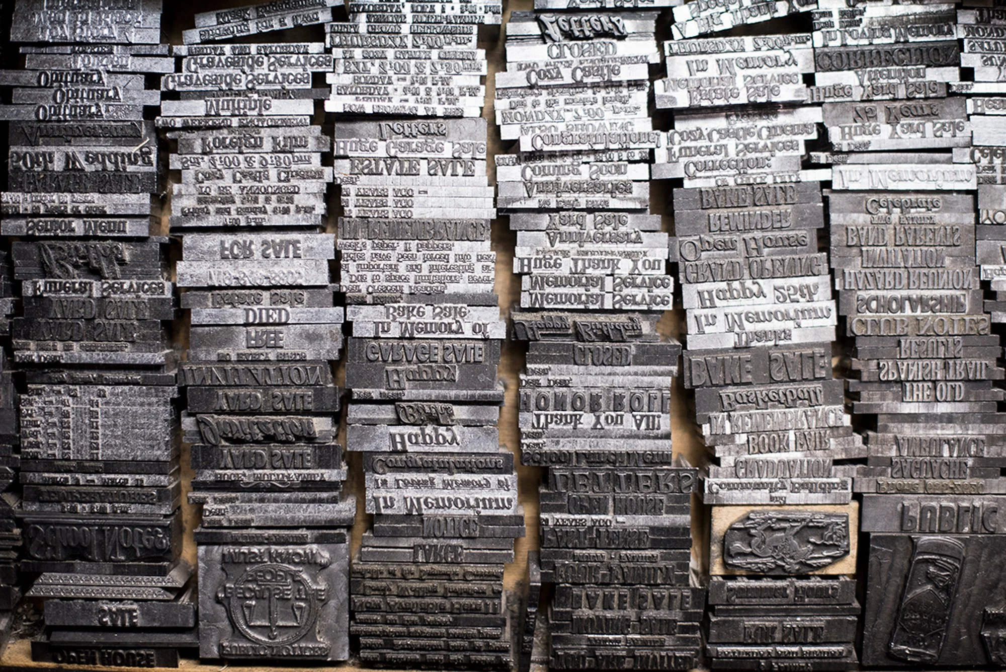Rows of metal type slugs stacked inside the Saguache Crescent