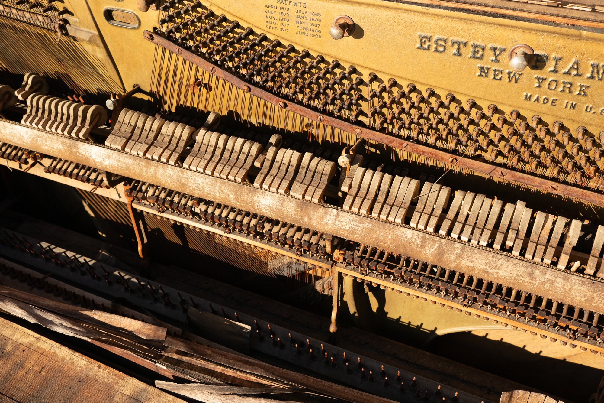 Antique Estey piano interior mechanism photographed in Helper Utah