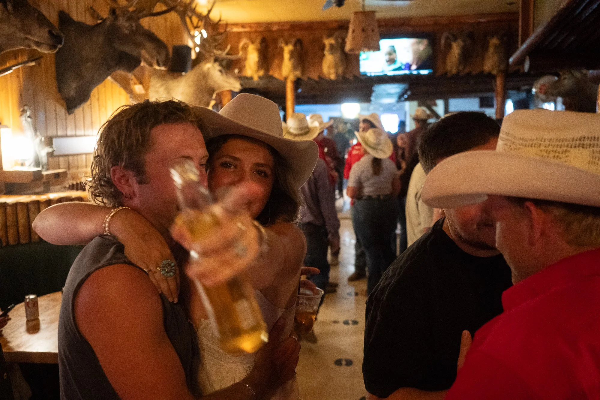 People gather inside the Rustic Pine Tavern after the rodeo in Dubois Wyoming