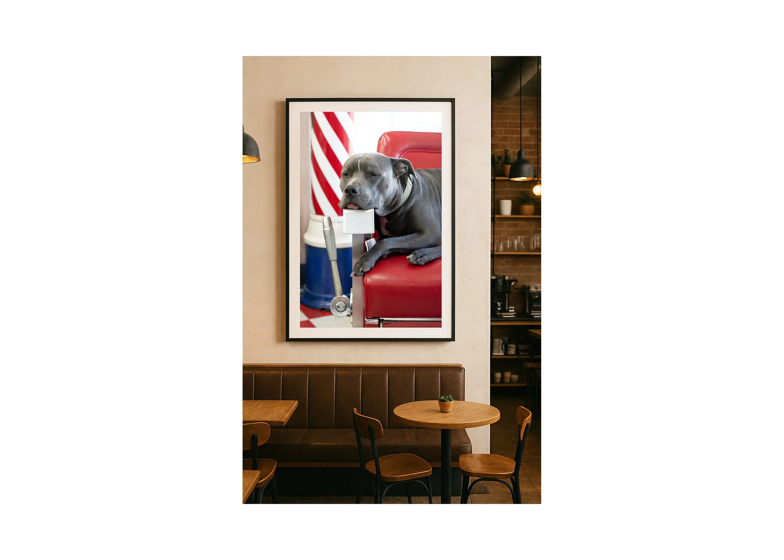 Pit bull resting on barber chair arm in a traditional barbershop with barber pole in background