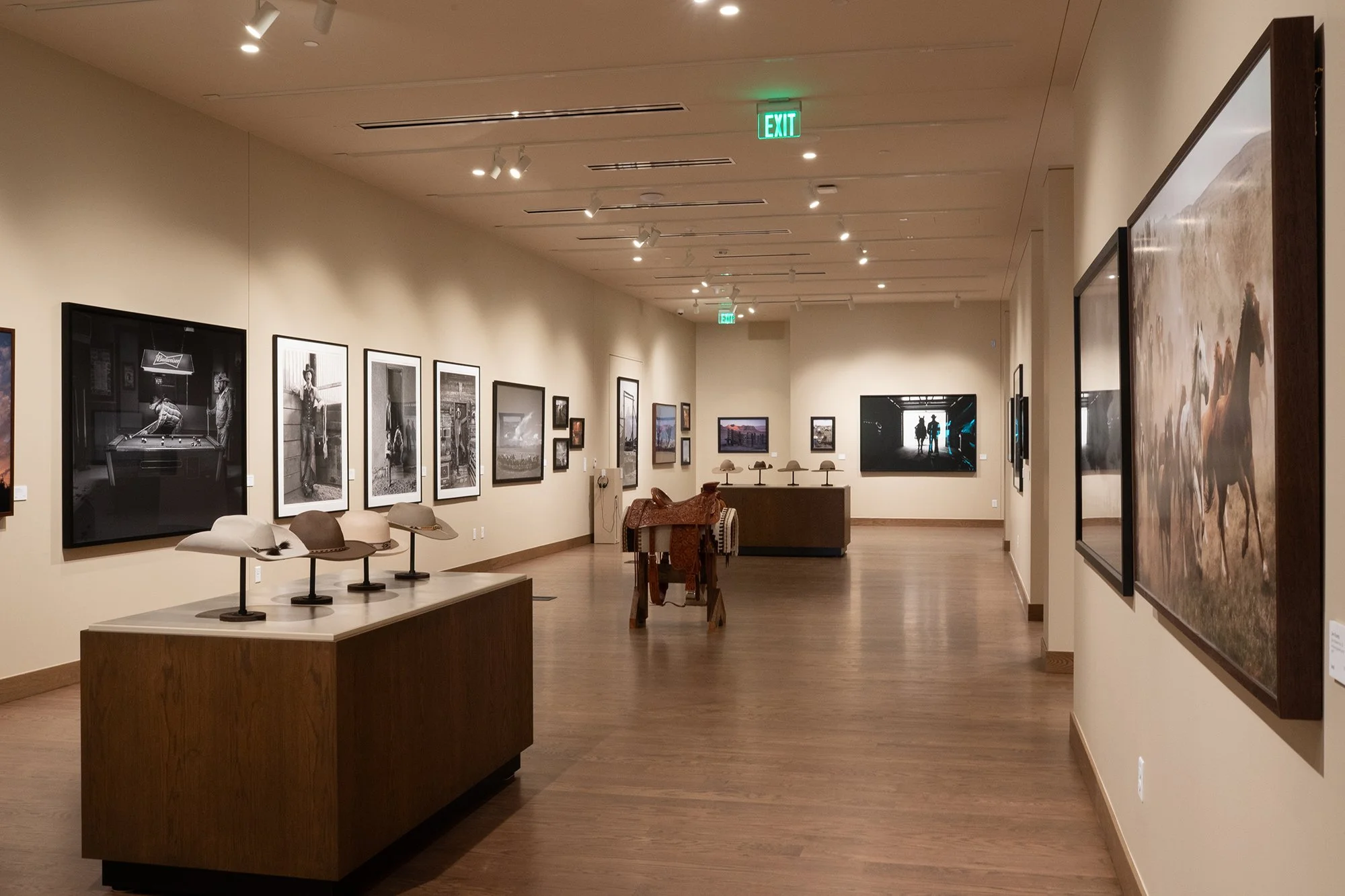 Photograph of western cowboy photography prints in a high end art gallery