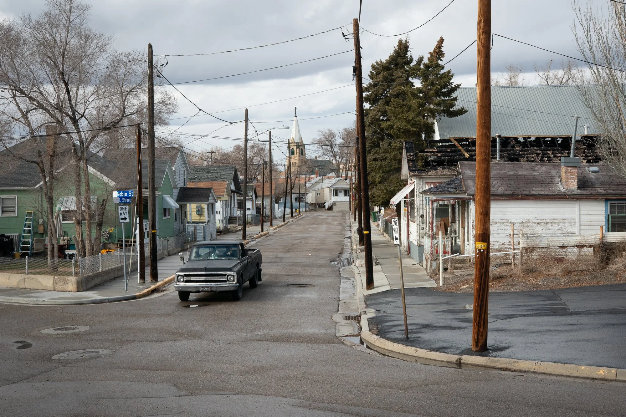 Pickup truck driving through residential neighborhood street in Rock Springs Wyoming