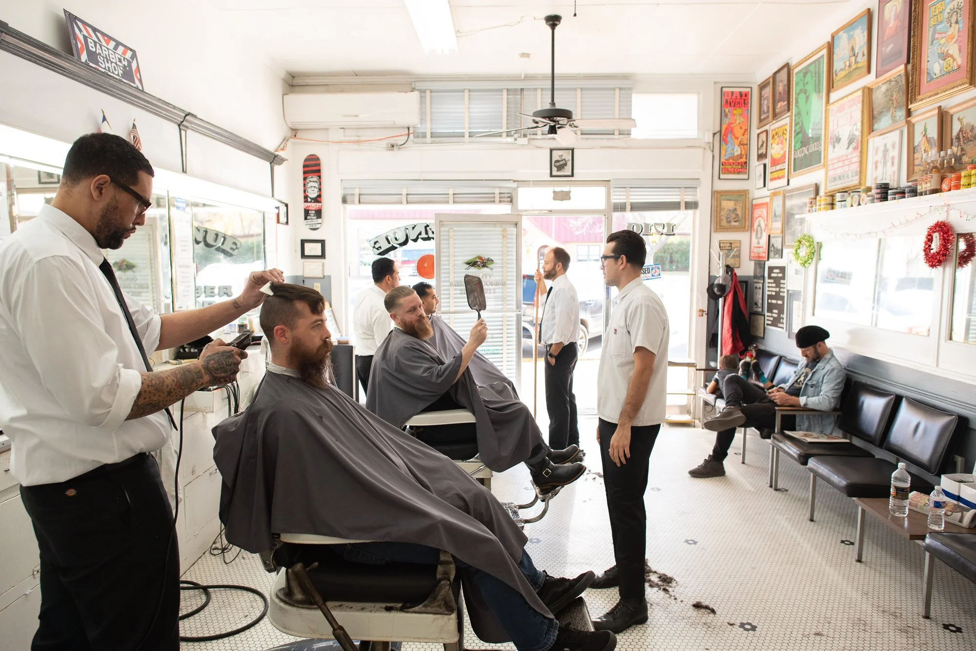Barbers work throughout Avenue Barbershop in Austin, Texas