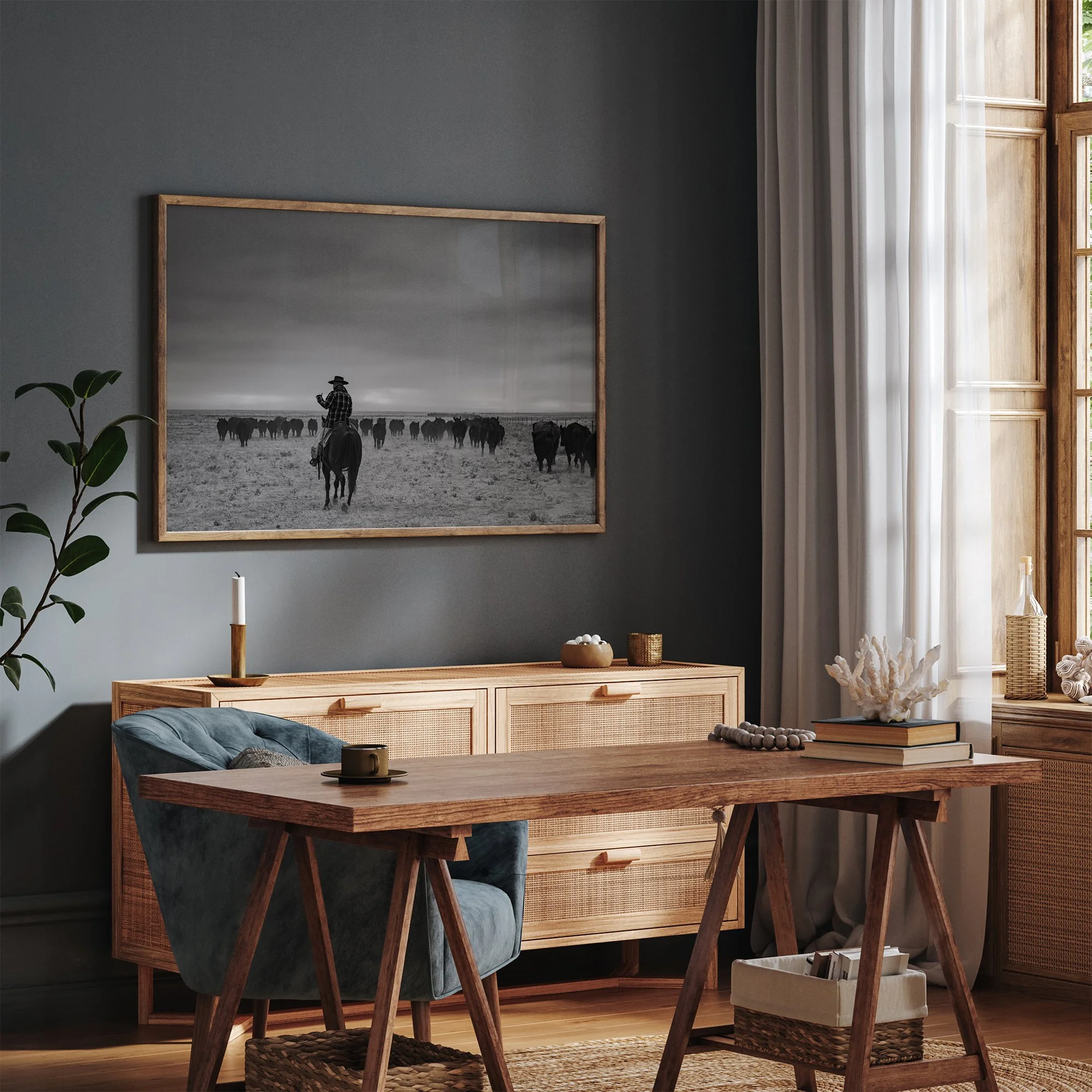 Photographing print of a buckaroo trailing cattle on a Nevada Ranch