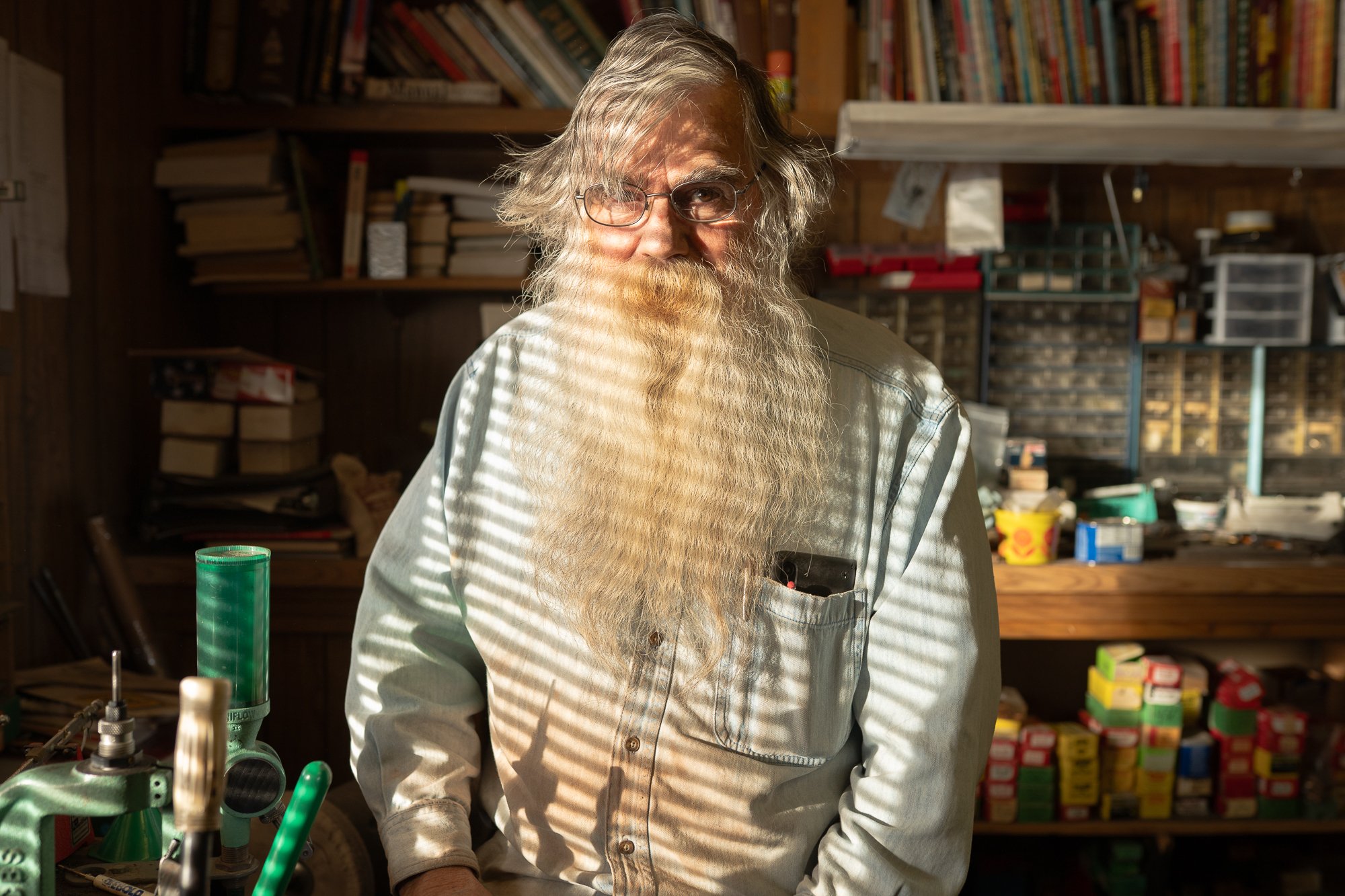 Portrait of a man standing inside a Western workshop in Wyoming