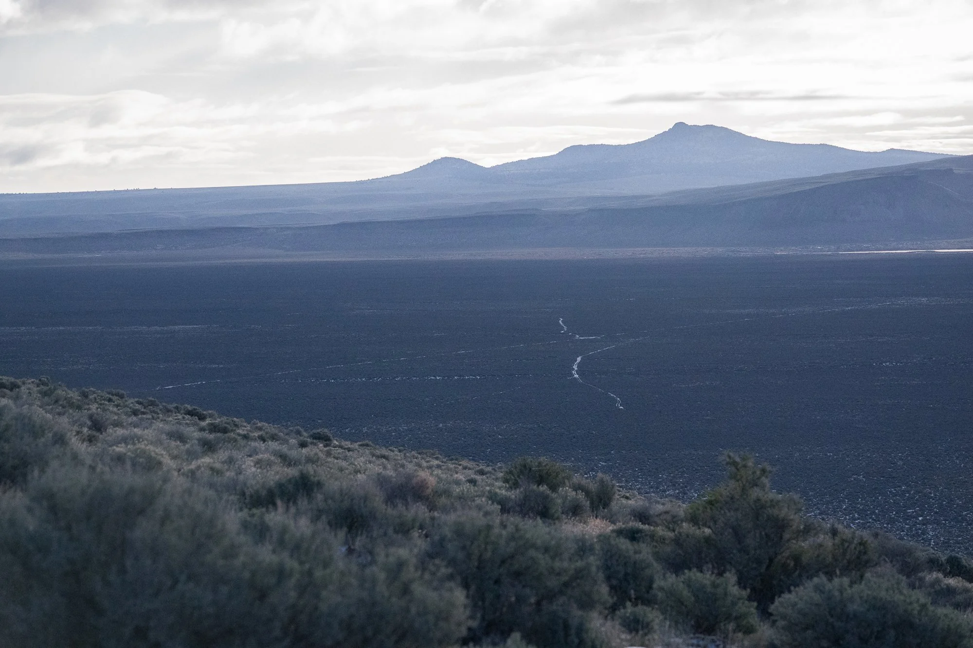 A wide from the desert landscape and mountains on the ZX Ranch in Paisley, Oregon