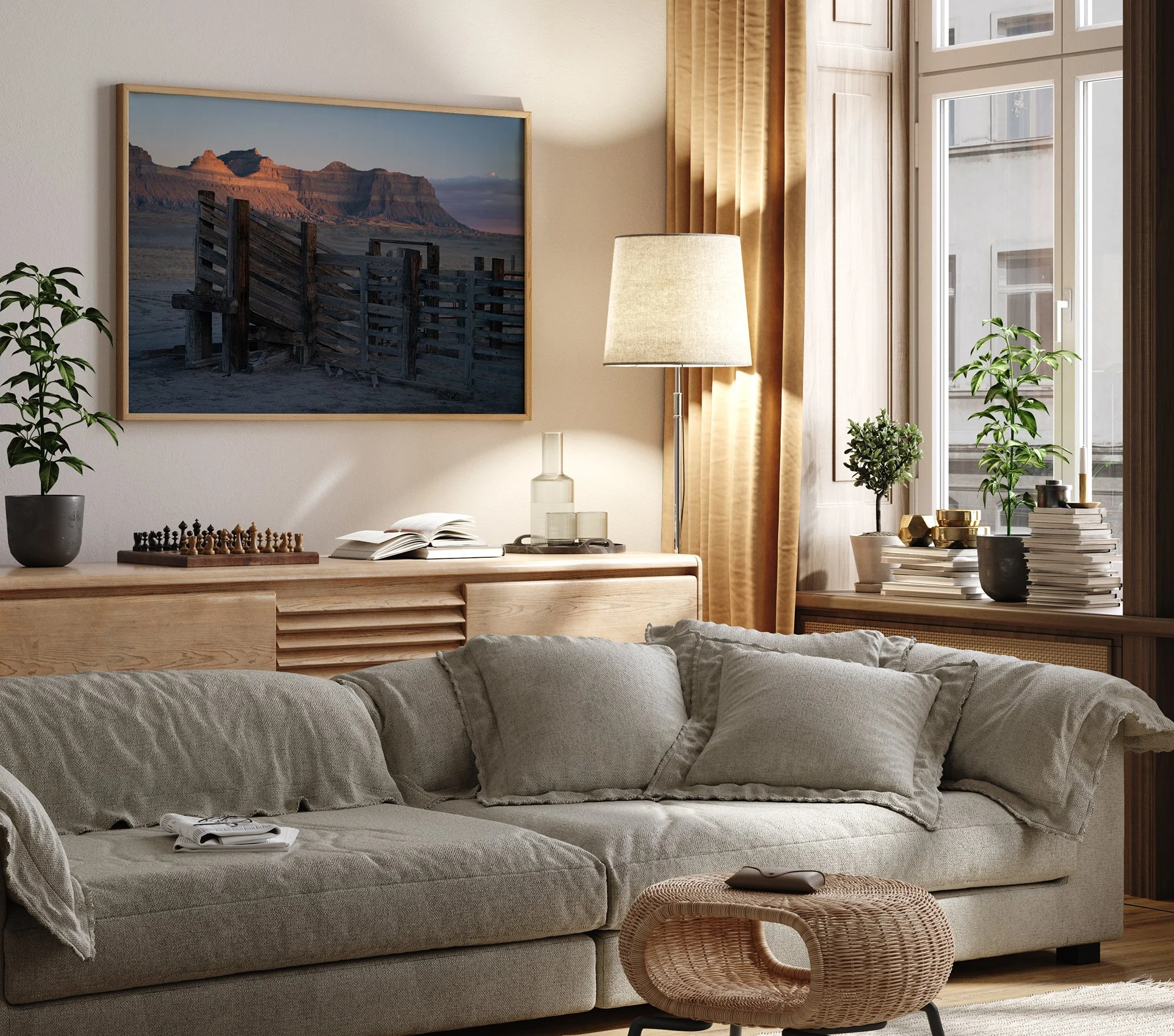 Fine art cowboy photography print of a Western cattle corral displayed in a warm, modern living room interior.