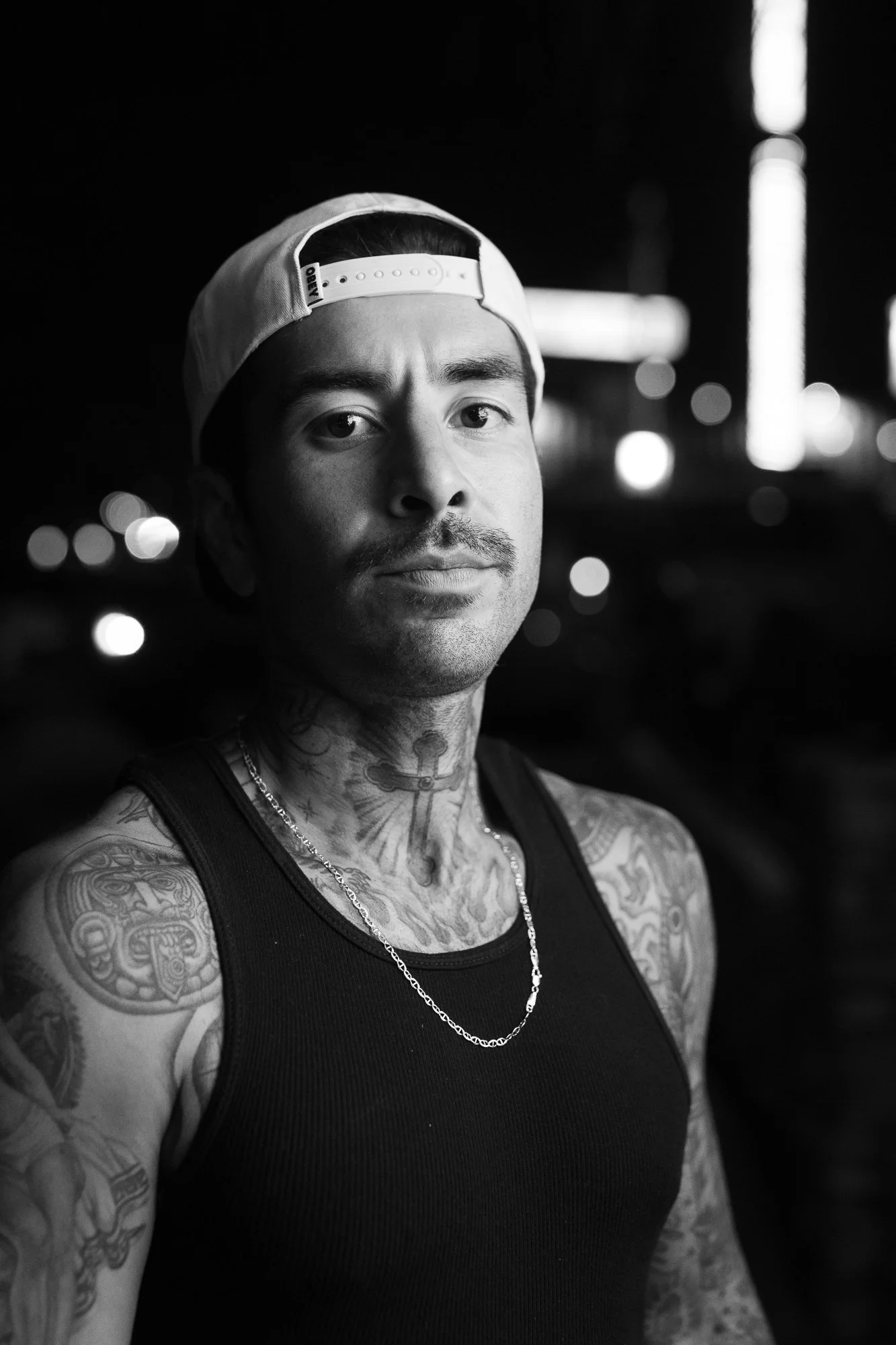 Black and white portrait of Emiliano Zermeno, owner of Leucadia Barbershop in Encinitas, California.