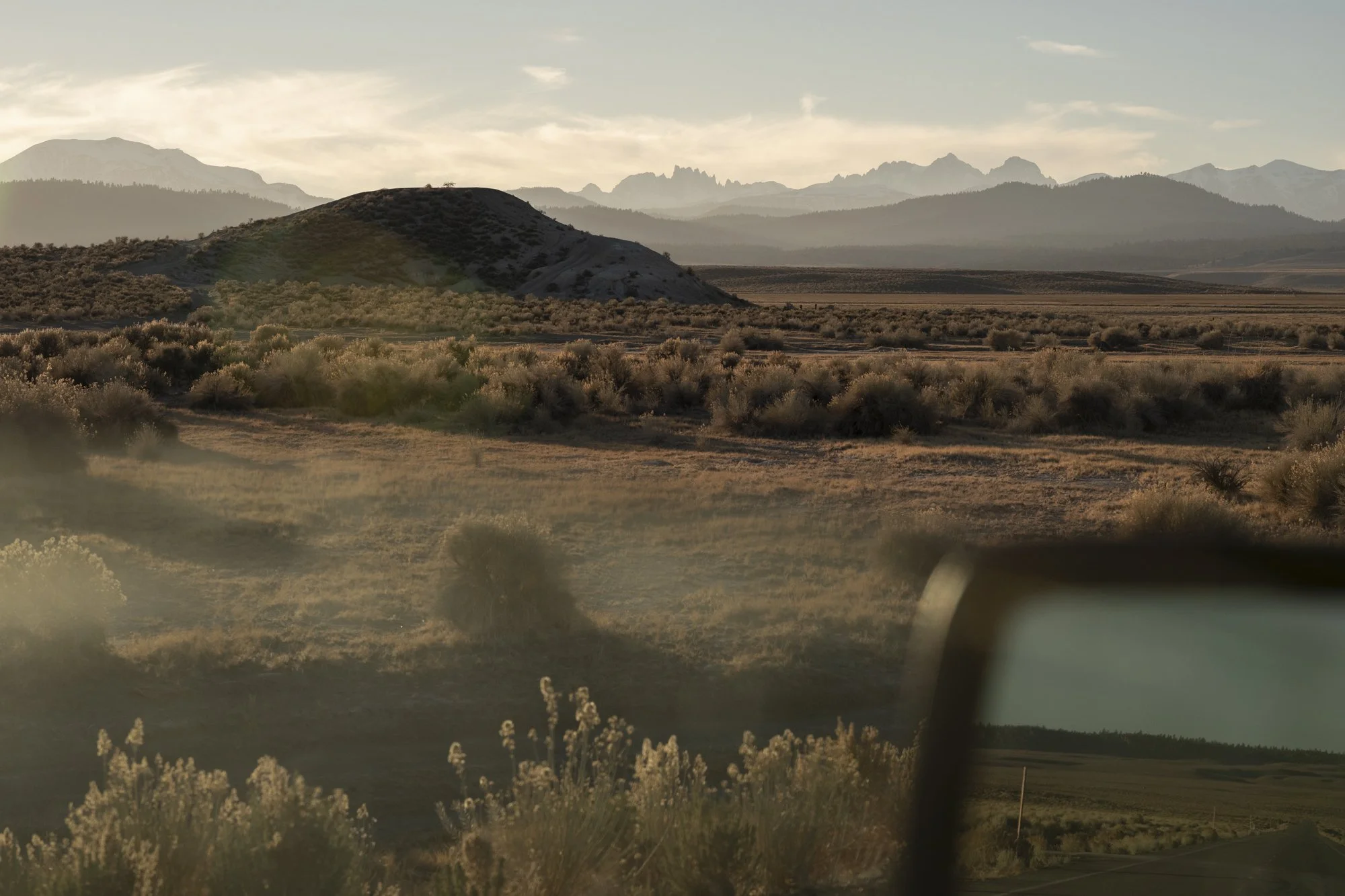 Driving through the Eastern Sierra Mountains near Mammoth, California at sunset