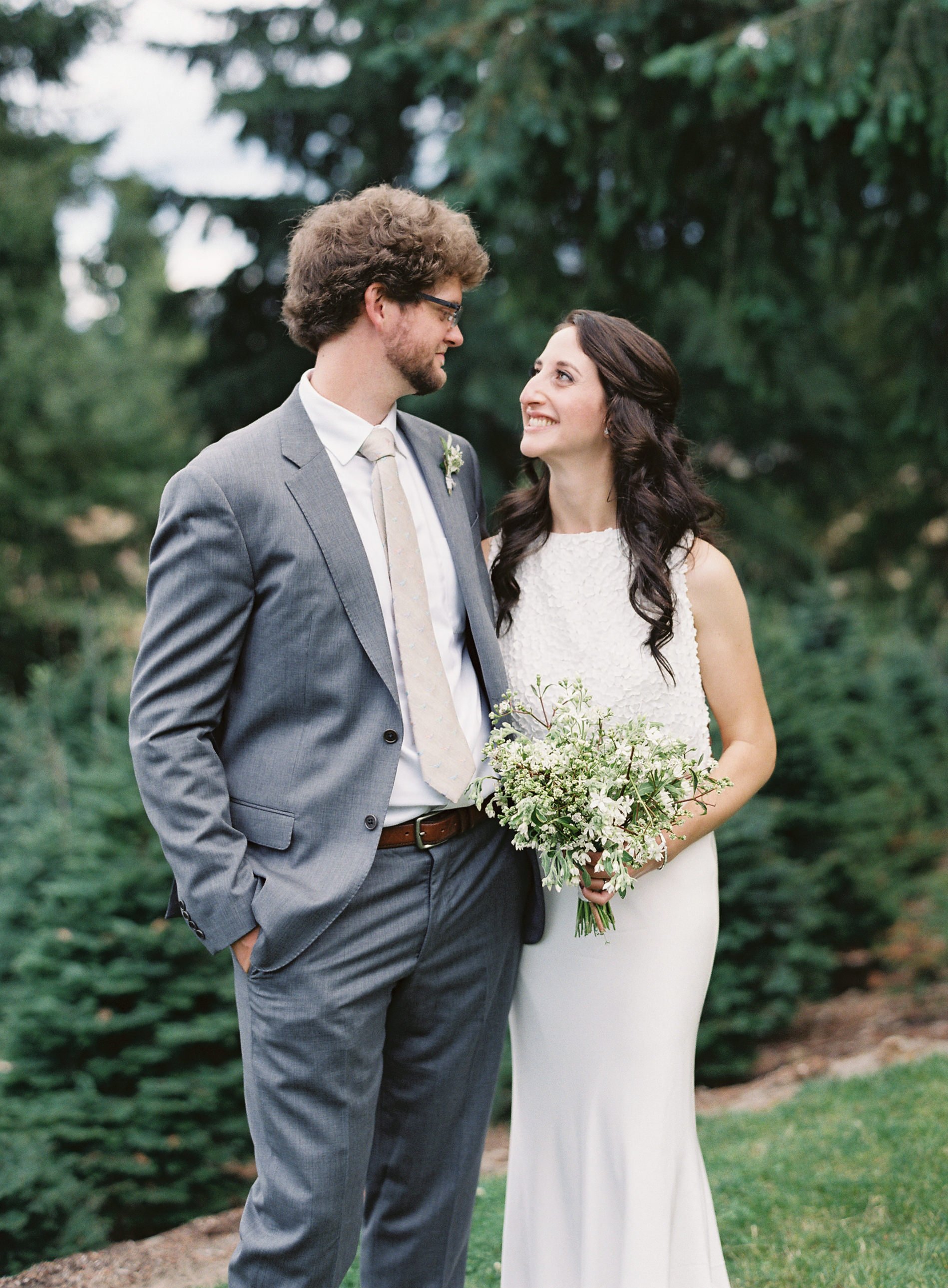 Bride and Groom with White and Green Bouquet