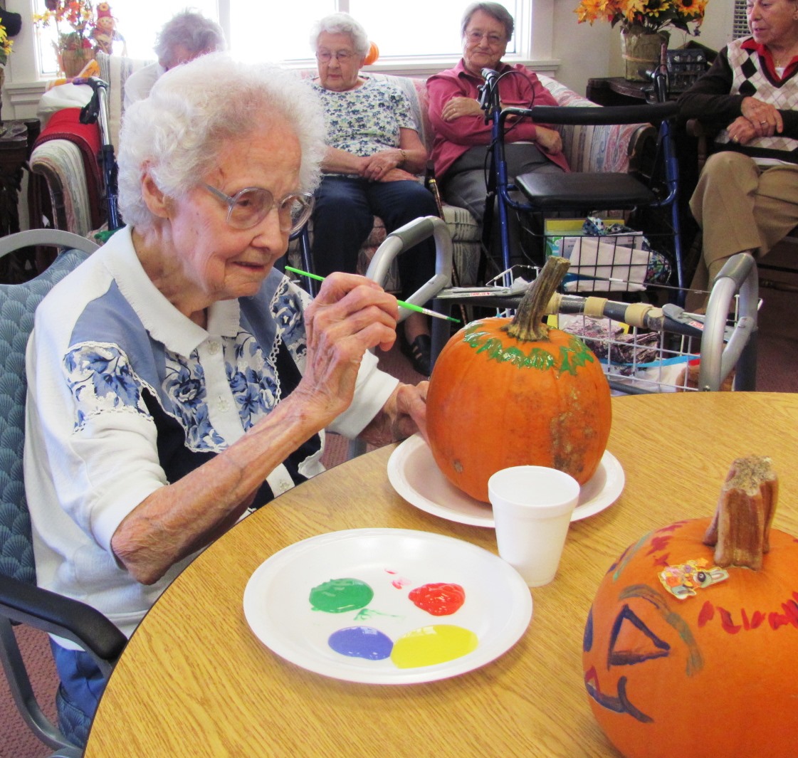 Louise_Garnier_painting_pumpkin.jpg