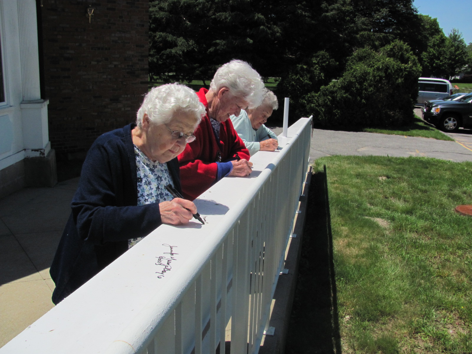 Topping_Off_Ceremony_June_2013_-_Residents_signing_the_beam.jpg