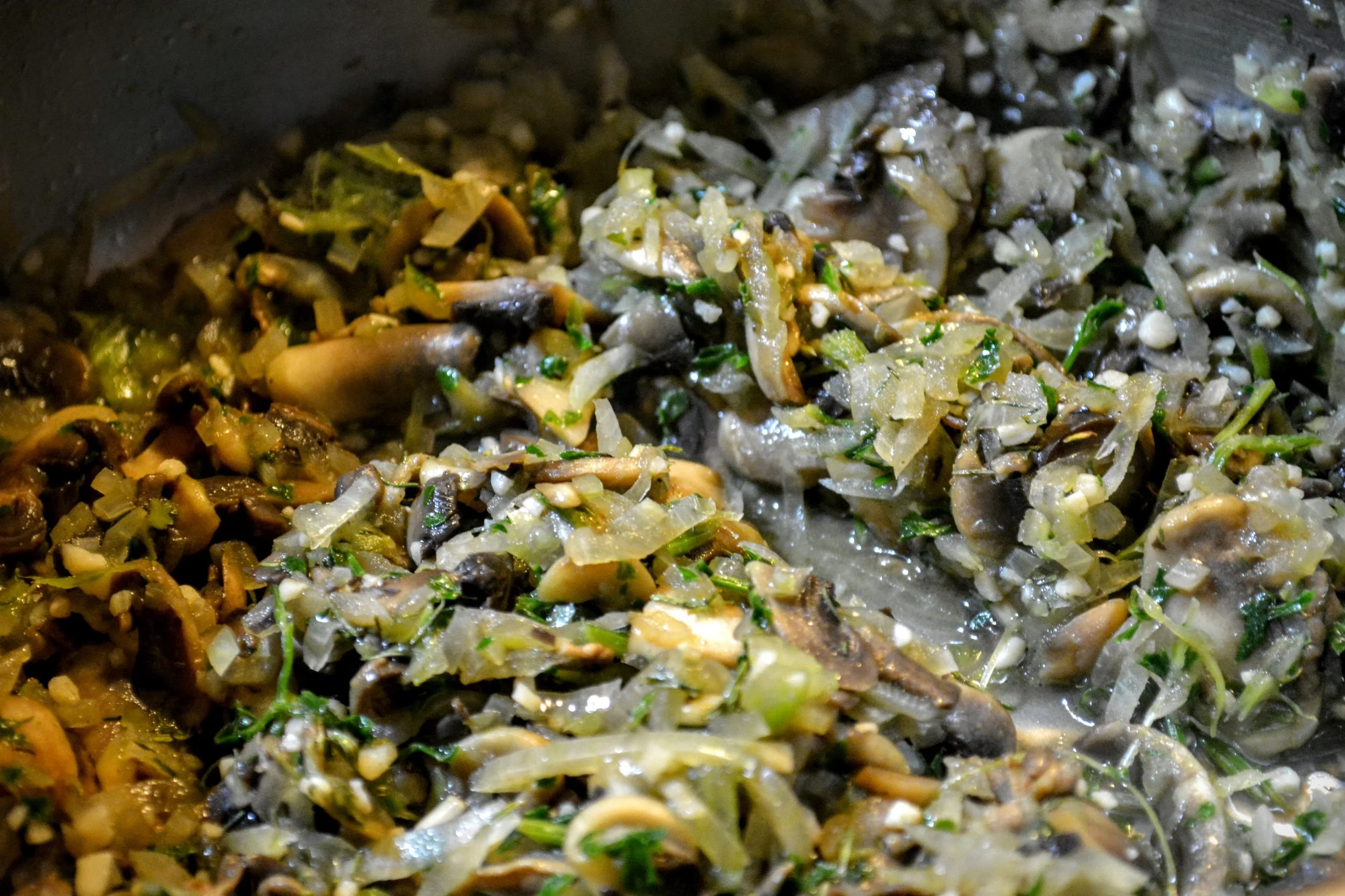 Cook the onion, mushroom, celery, and parsley all together in a pot until it smells like heaven. Use oil or shortening to keep it from sticking to the pot. 