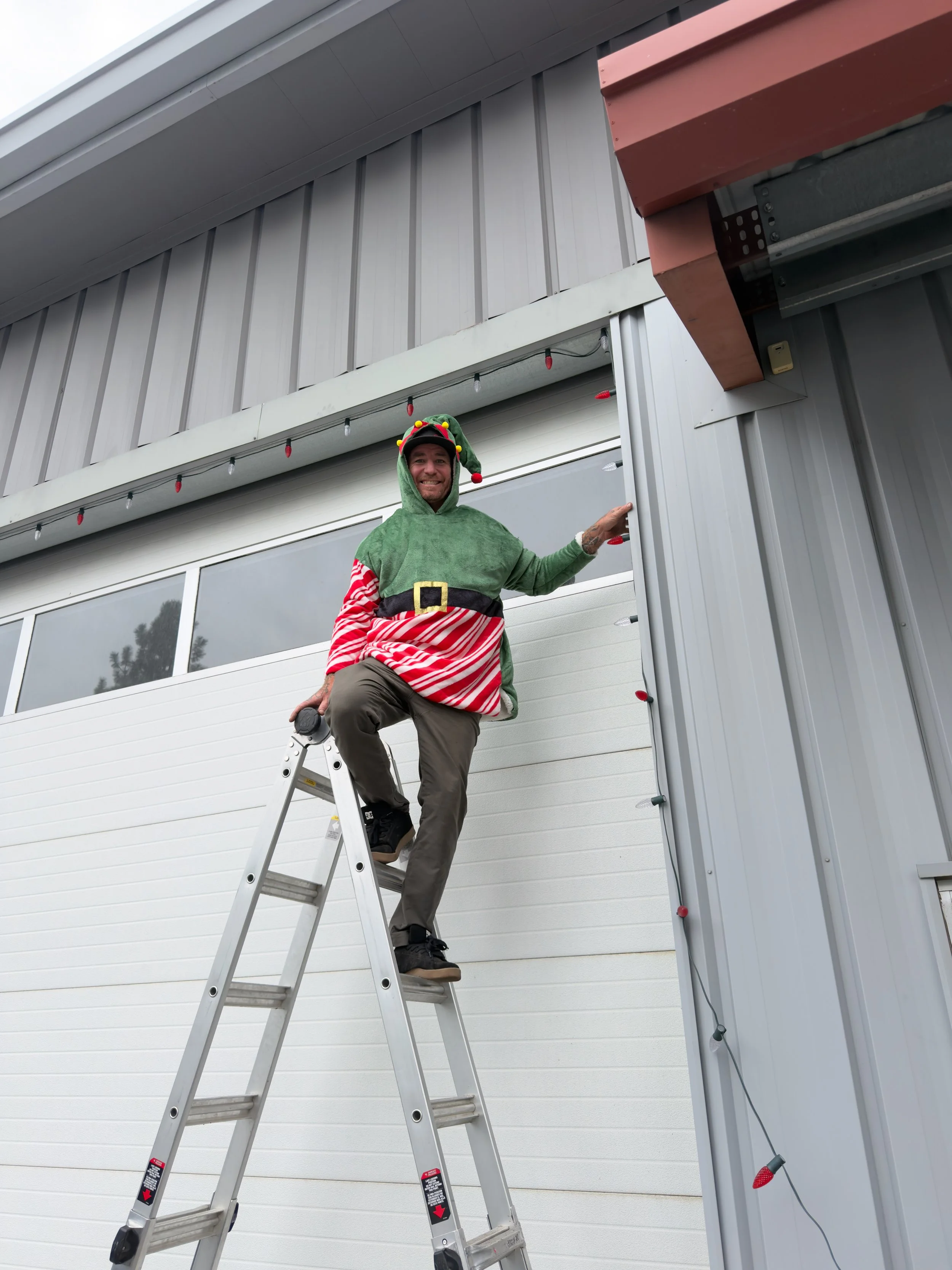 Small business warehouse with installer in Christmas spirit 