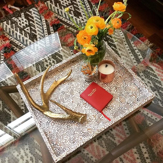 Sneak peek at @kdkoral  new digs! Full &quot;after&quot; coming soon... #interiordesign #after #clientlove #rug #potterybarn #westelm #coffeetable #ranunculus #midcenturymodern #kilim