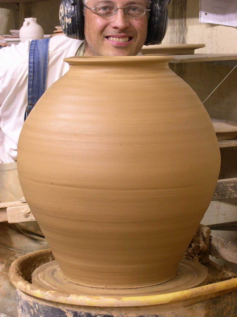 Here we see our geeky potter hamming it up after the work is done. Handles will go on the jar in the morning.